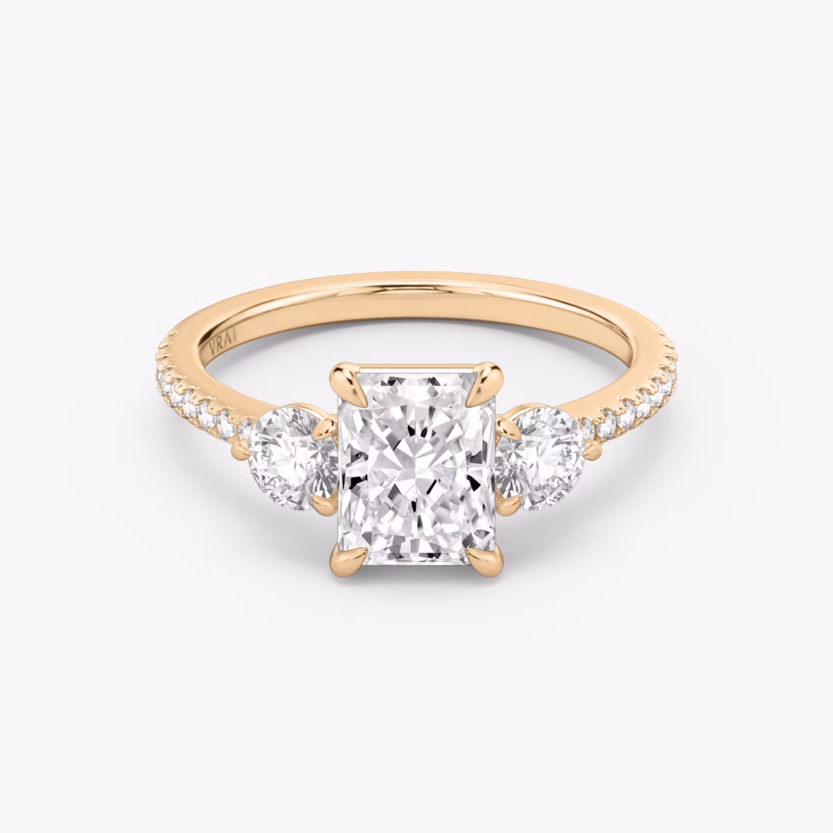 The Three Stone | Radiant | 14k | Rose Gold | bandAccent: Pavé | sideStoneCarat: 0.25ct | sideStoneShape: Round Brilliant | diamondOrientation: vertical | caratWeight: other