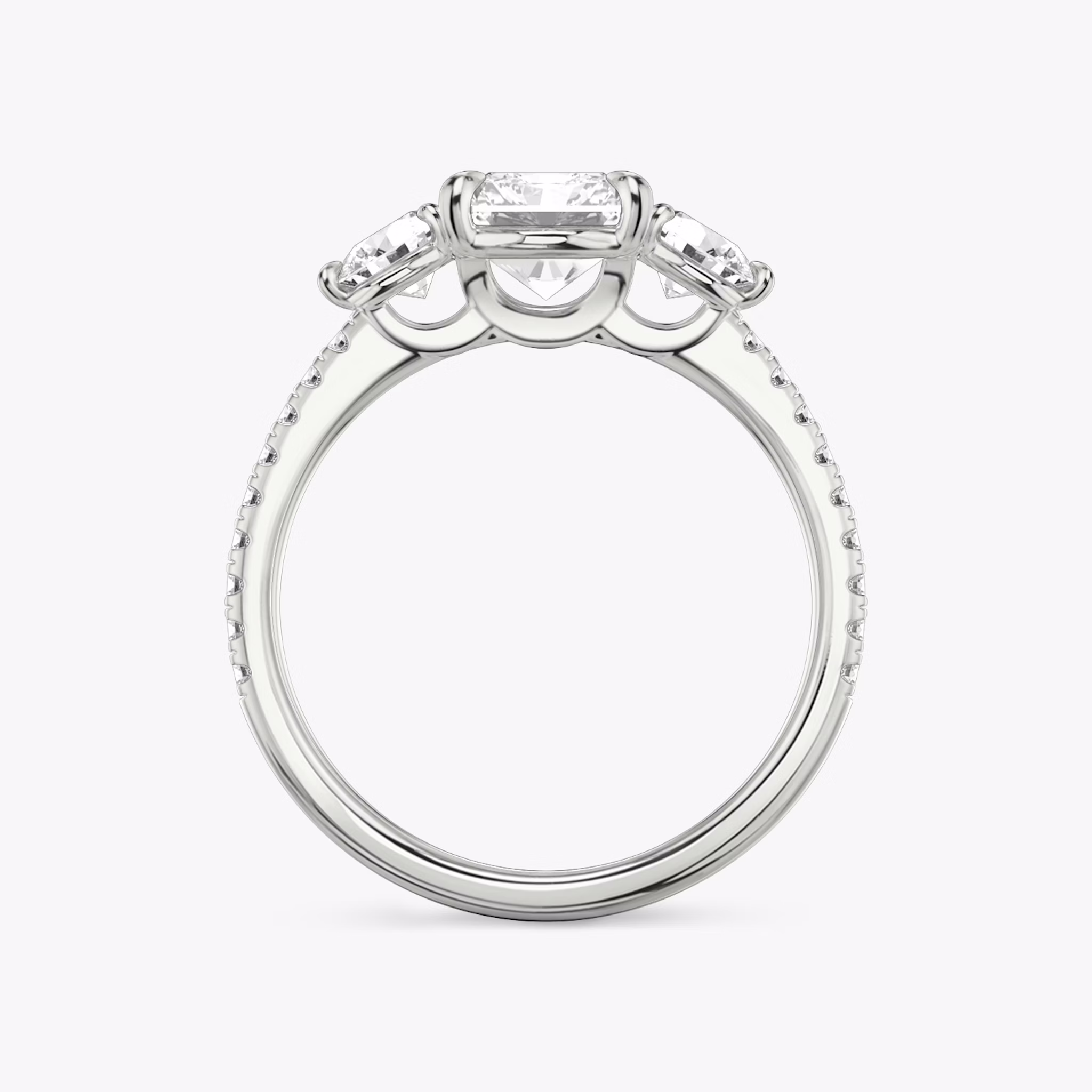 The Three Stone | Radiant | Platinum | bandAccent: Pavé | sideStoneCarat: 0.25ct | sideStoneShape: Round Brilliant | diamondOrientation: vertical | caratWeight: other