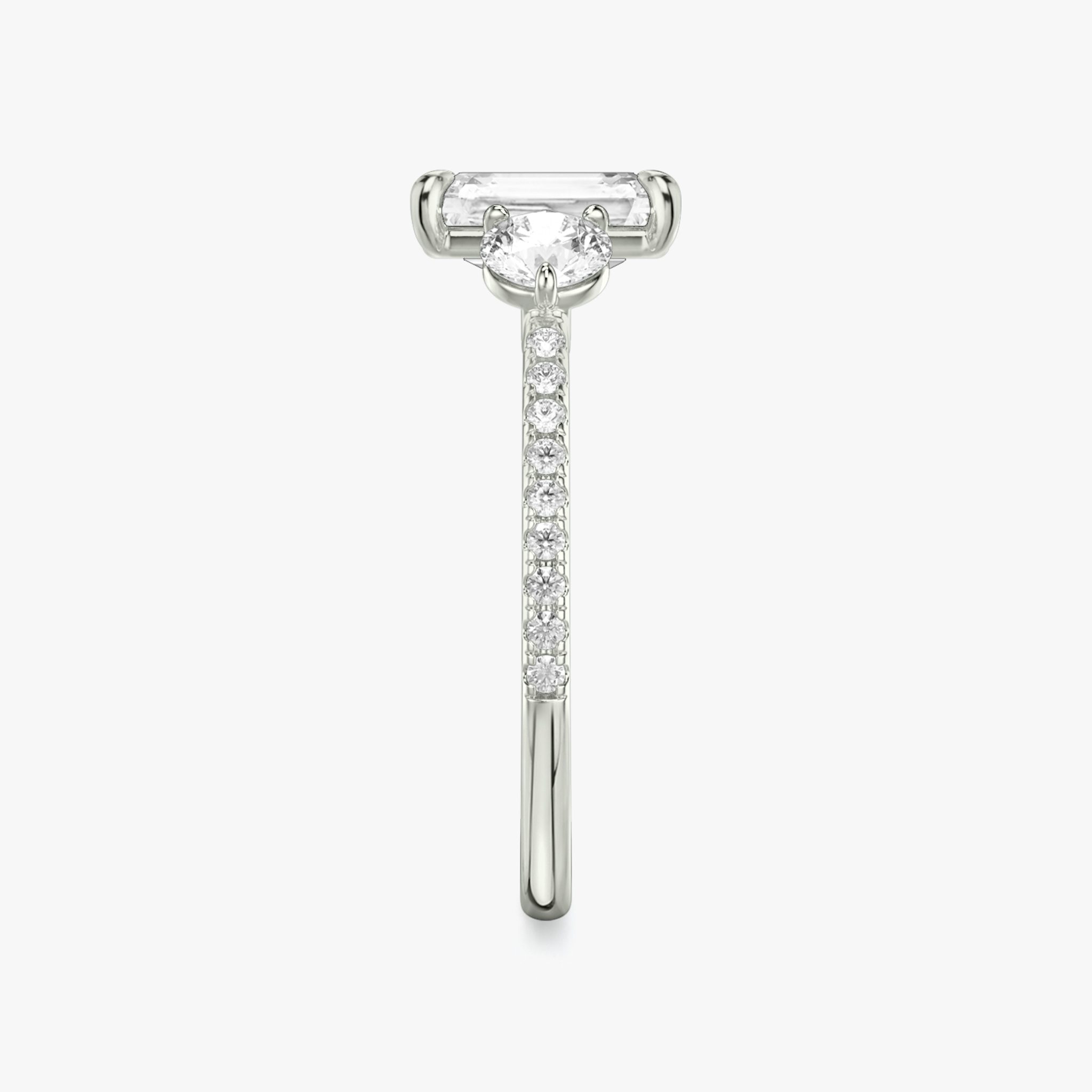 The Three Stone | Radiant | Platinum | bandAccent: Pavé | sideStoneCarat: 0.25ct | sideStoneShape: Round Brilliant | diamondOrientation: vertical | caratWeight: other