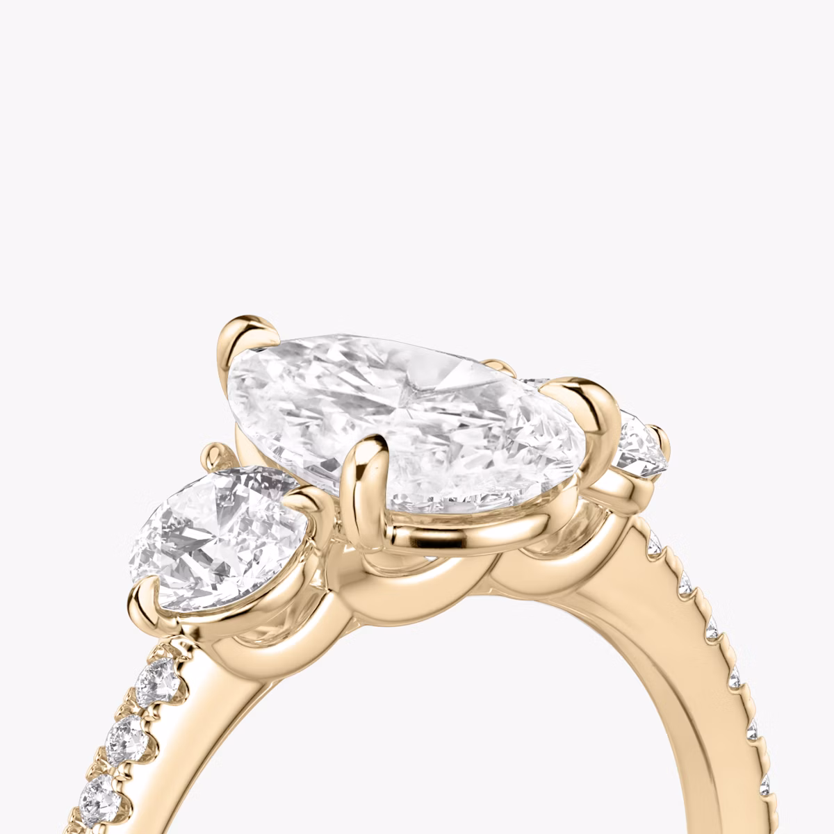 The Three Stone | Pear | 14k | Rose Gold | bandAccent: Pavé | sideStoneCarat: 0.25ct | sideStoneShape: Round Brilliant | diamondOrientation: vertical | caratWeight: other