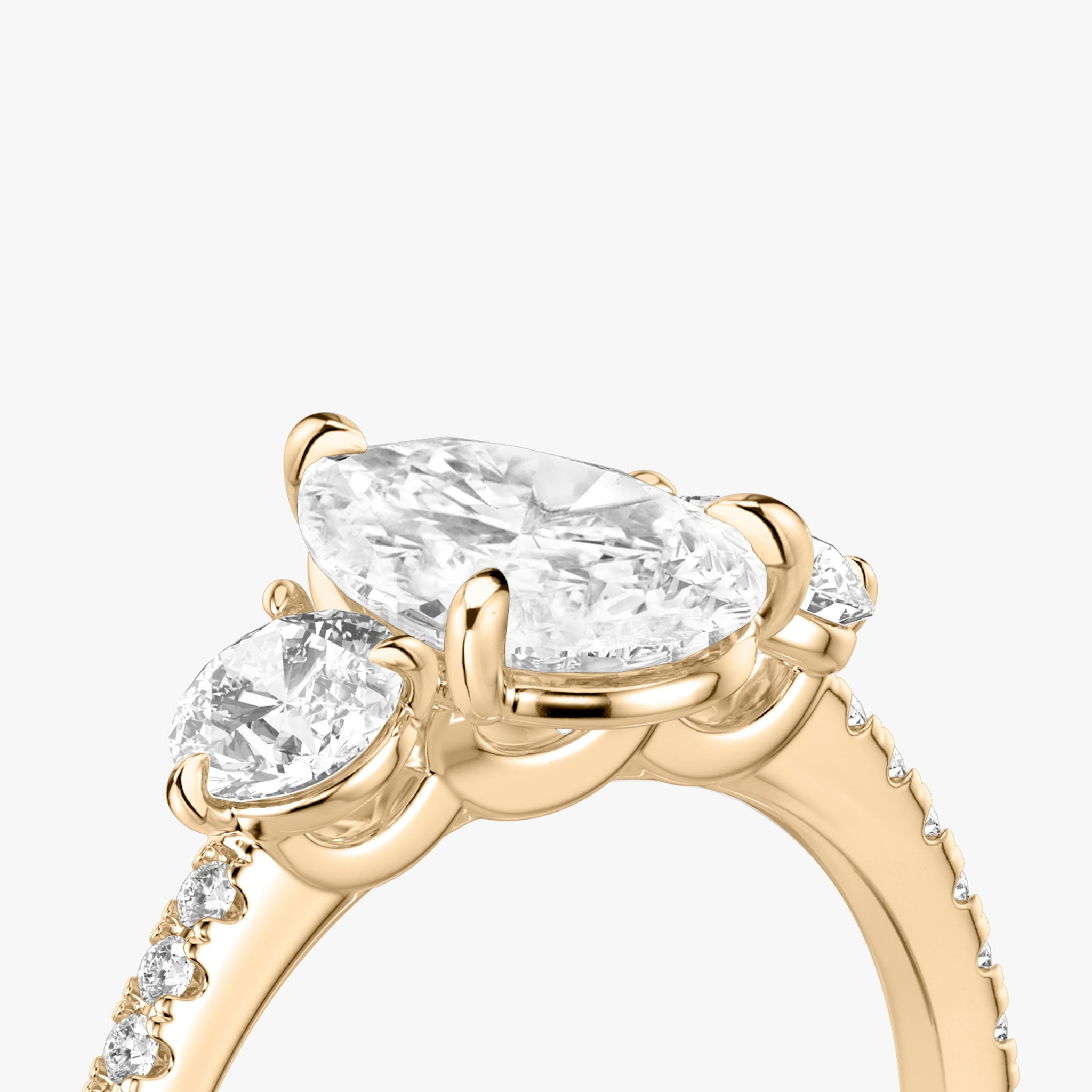 The Three Stone | Pear | 14k | Rose Gold | bandAccent: Pavé | sideStoneCarat: 0.25ct | sideStoneShape: Round Brilliant | diamondOrientation: vertical | caratWeight: other