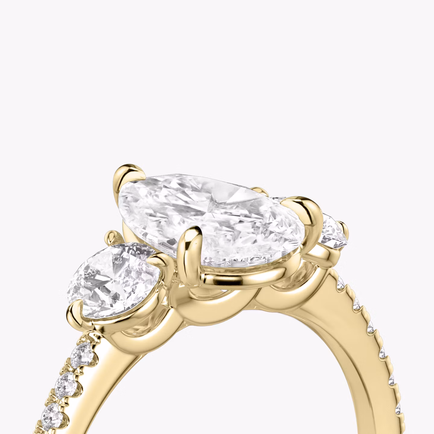 The Three Stone | Pear | 18k | Yellow Gold | bandAccent: Pavé | sideStoneCarat: 0.25ct | sideStoneShape: Round Brilliant | diamondOrientation: vertical | caratWeight: other
