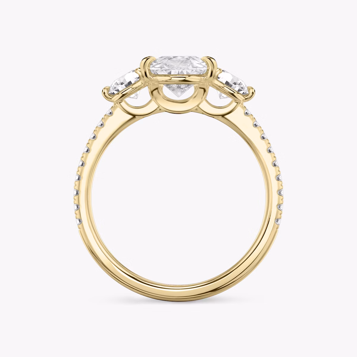 The Three Stone | Pear | 18k | Yellow Gold | bandAccent: Pavé | sideStoneCarat: 0.25ct | sideStoneShape: Round Brilliant | diamondOrientation: vertical | caratWeight: other