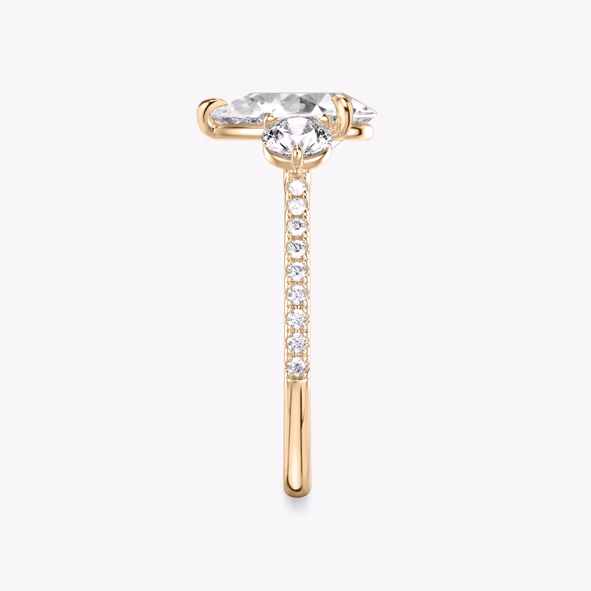 The Three Stone | Pear | 14k | Rose Gold | bandAccent: Pavé | sideStoneCarat: 0.25ct | sideStoneShape: Round Brilliant | diamondOrientation: vertical | caratWeight: other