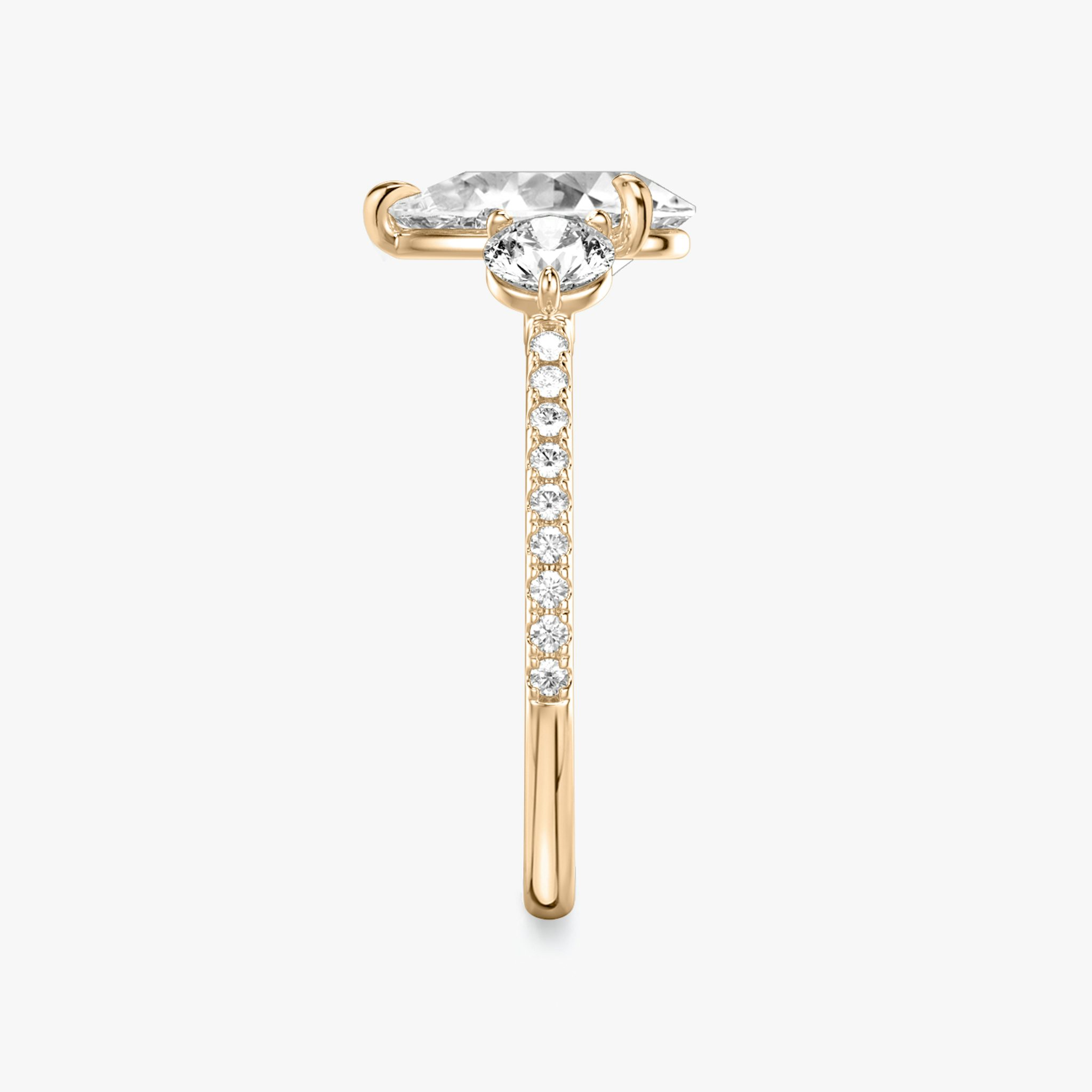 The Three Stone | Pear | 14k | Rose Gold | bandAccent: Pavé | sideStoneCarat: 0.25ct | sideStoneShape: Round Brilliant | diamondOrientation: vertical | caratWeight: other