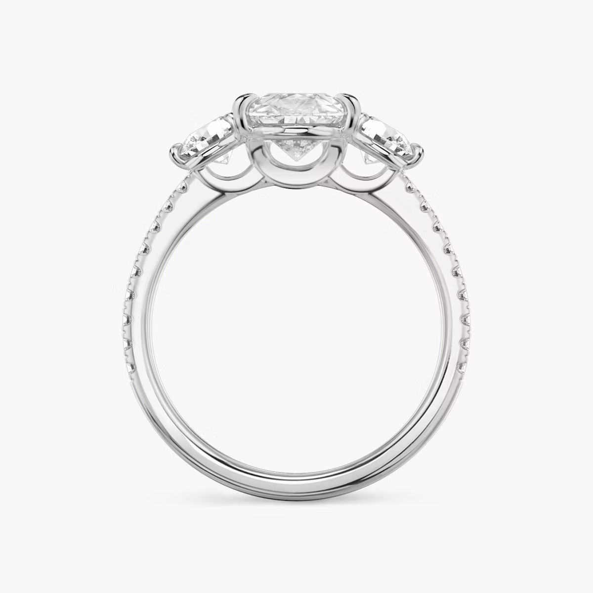 The Three Stone | Pear | Platinum | bandAccent: Pavé | sideStoneCarat: 0.25ct | sideStoneShape: Round Brilliant | diamondOrientation: vertical | caratWeight: other