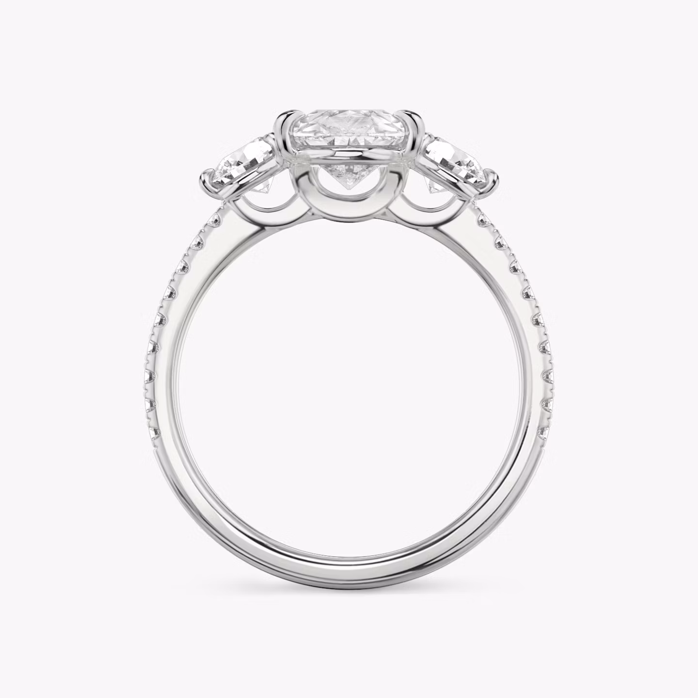 The Three Stone | Pear | Platinum | bandAccent: Pavé | sideStoneCarat: 0.25ct | sideStoneShape: Round Brilliant | diamondOrientation: vertical | caratWeight: other