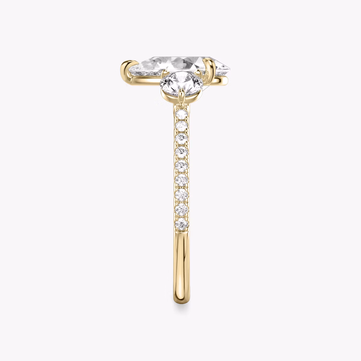 The Three Stone | Pear | 18k | Yellow Gold | bandAccent: Pavé | sideStoneCarat: 0.25ct | sideStoneShape: Round Brilliant | diamondOrientation: vertical | caratWeight: other