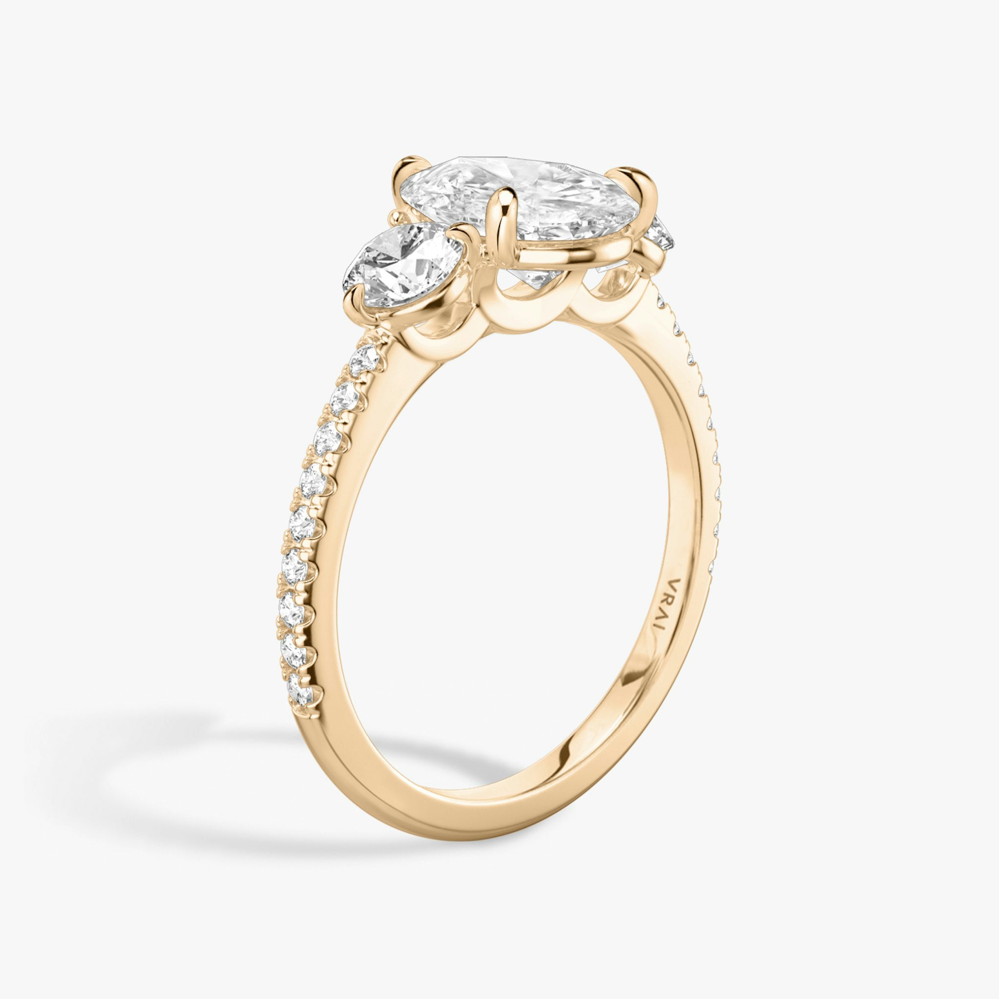 The Three Stone | Pear | 14k | Rose Gold | bandAccent: Pavé | sideStoneCarat: 0.25ct | sideStoneShape: Round Brilliant | diamondOrientation: vertical | caratWeight: other