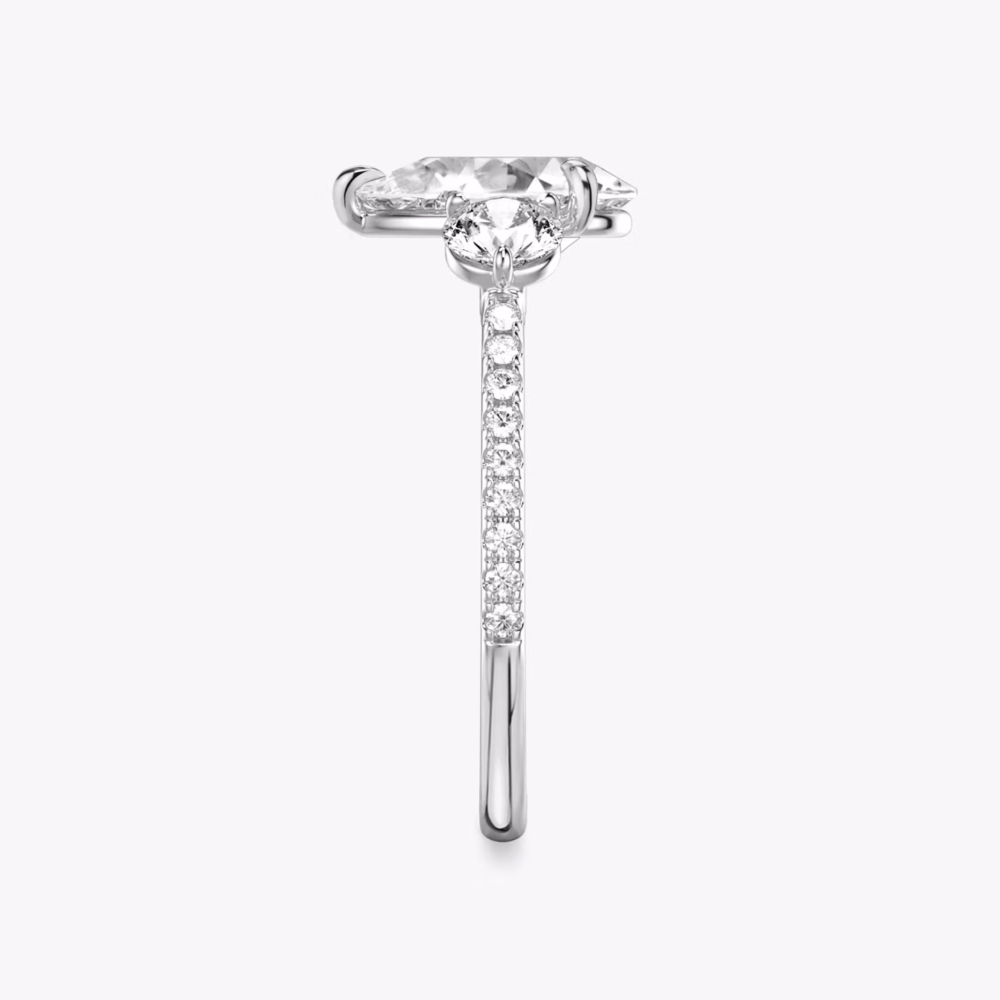 The Three Stone | Pear | Platinum | bandAccent: Pavé | sideStoneCarat: 0.25ct | sideStoneShape: Round Brilliant | diamondOrientation: vertical | caratWeight: other