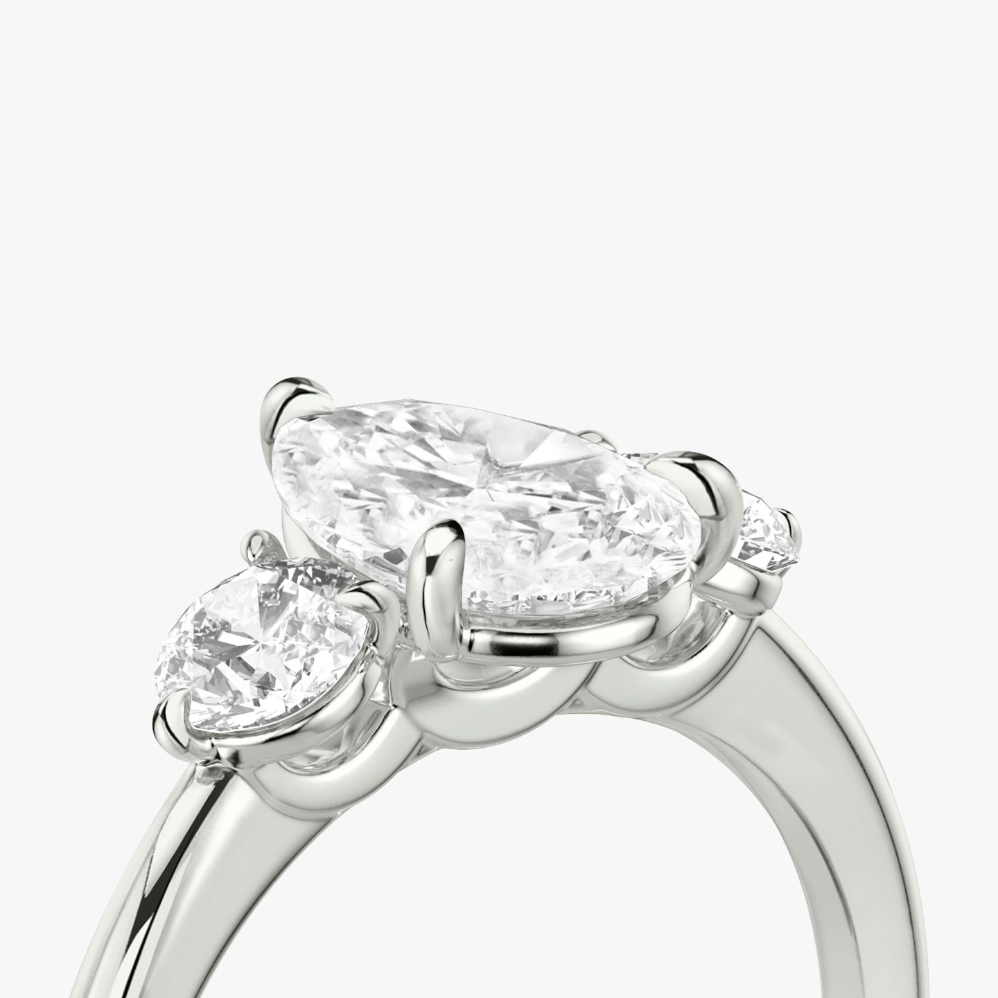 The Three Stone | Pear | 18k | White Gold | bandAccent: Plain | sideStoneCarat: 0.25ct | sideStoneShape: Round Brilliant | diamondOrientation: vertical | caratWeight: other