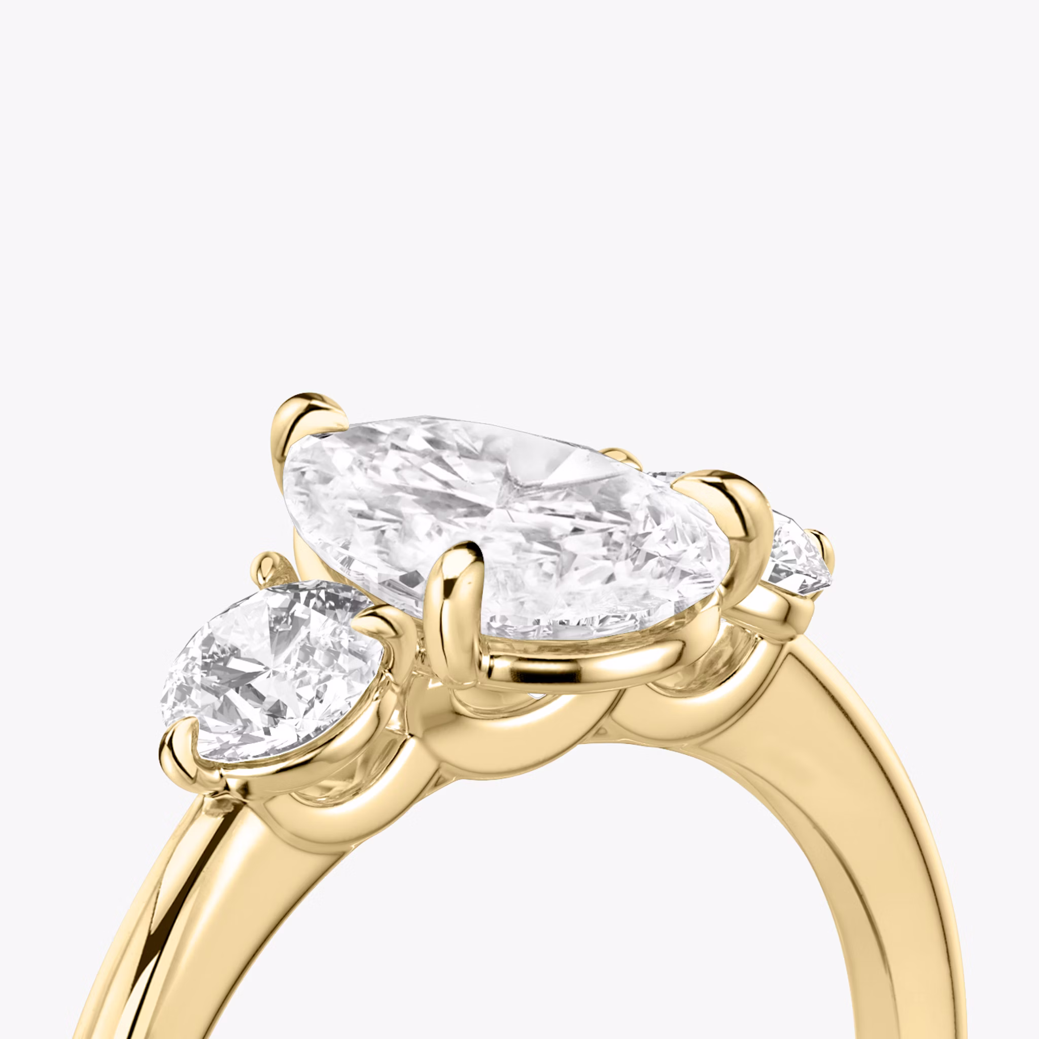 The Three Stone | Pear | 18k | Yellow Gold | bandAccent: Plain | sideStoneCarat: 0.25ct | sideStoneShape: Round Brilliant | diamondOrientation: vertical | caratWeight: other