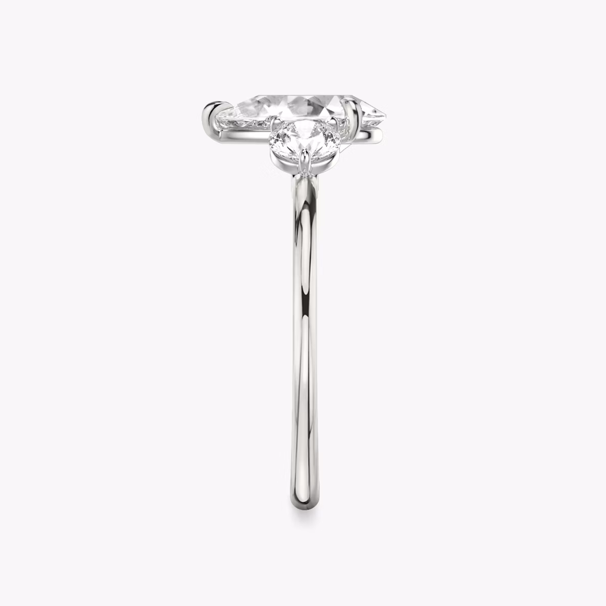 The Three Stone | Pear | Platinum | bandAccent: Plain | sideStoneCarat: 0.25ct | sideStoneShape: Round Brilliant | diamondOrientation: vertical | caratWeight: other