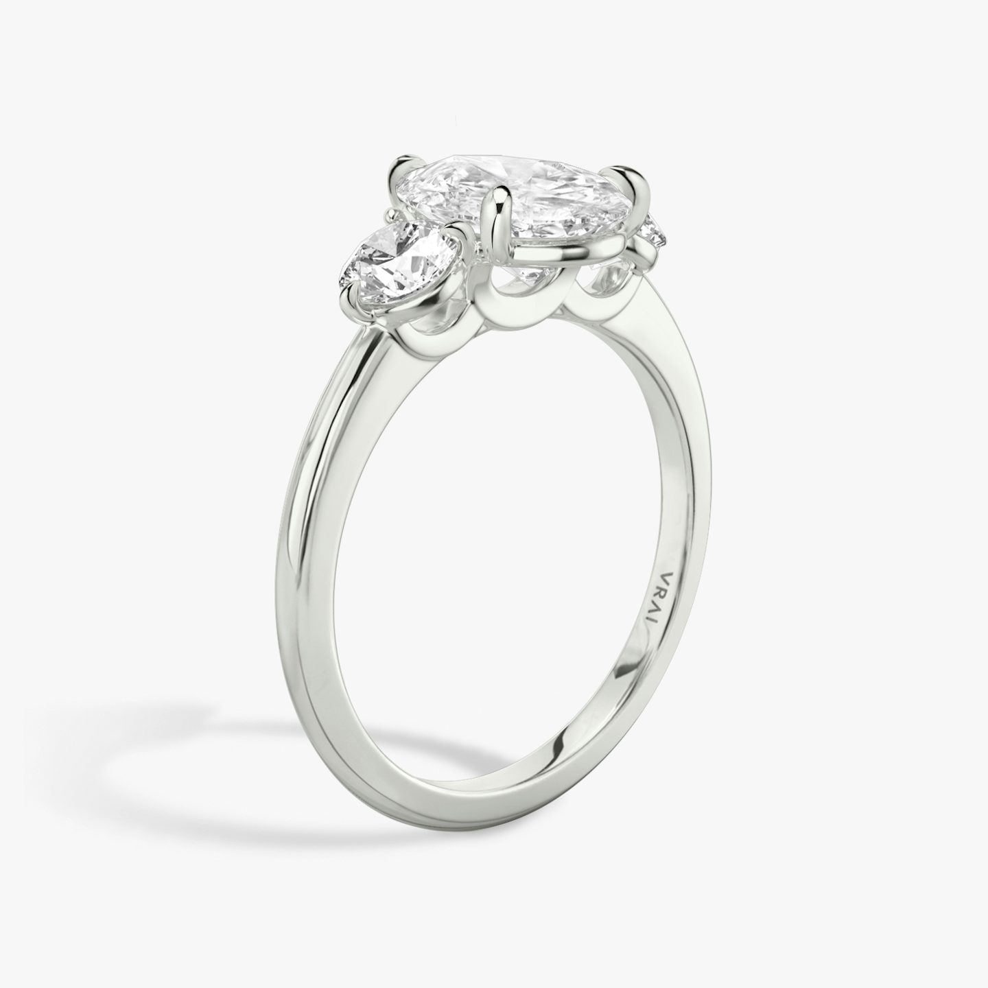 The Three Stone | Pear | 18k | White Gold | bandAccent: Plain | sideStoneCarat: 0.25ct | sideStoneShape: Round Brilliant | diamondOrientation: vertical | caratWeight: other