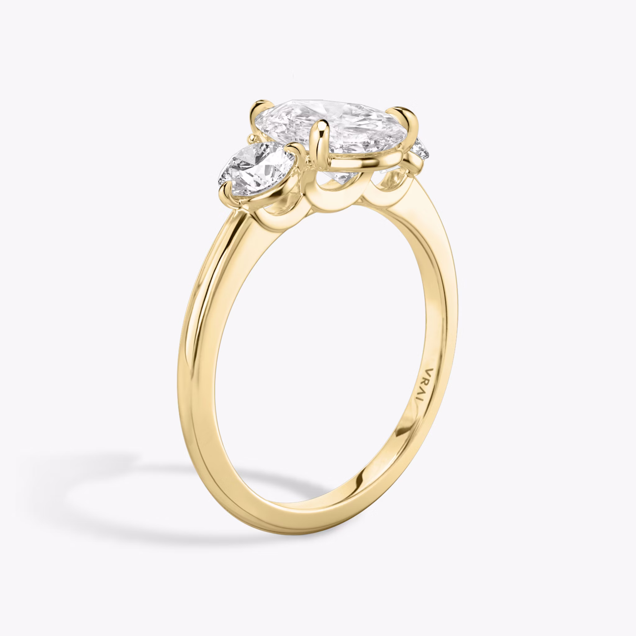 The Three Stone | Pear | 18k | Yellow Gold | bandAccent: Plain | sideStoneCarat: 0.25ct | sideStoneShape: Round Brilliant | diamondOrientation: vertical | caratWeight: other