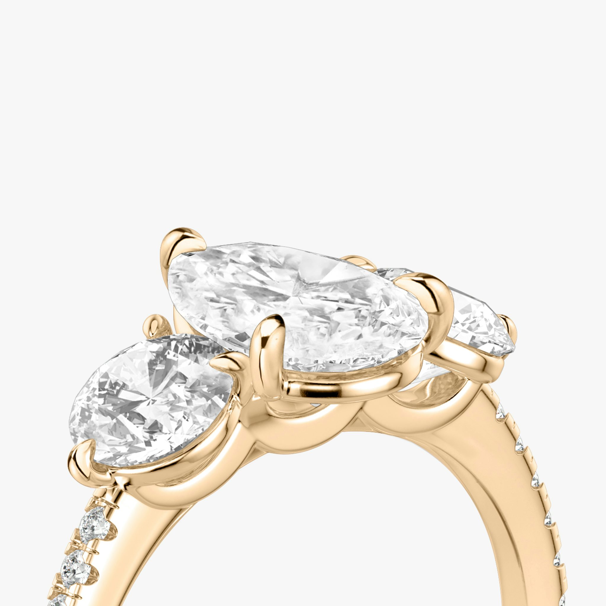 The Three Stone | Pear | 14k | Rose Gold | bandAccent: Pavé | sideStoneCarat: 0.50ct | sideStoneShape: Round Brilliant | diamondOrientation: vertical | caratWeight: other