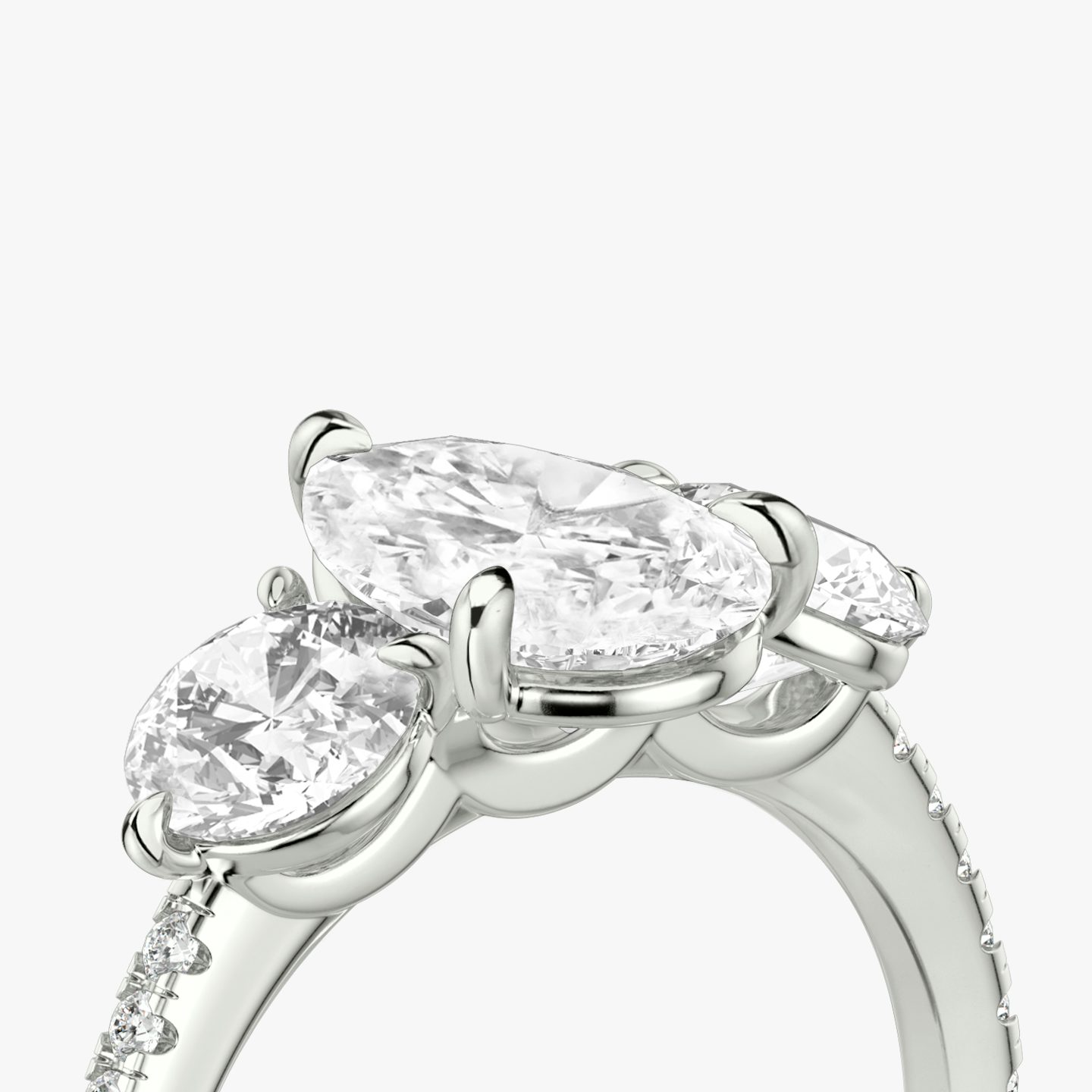 The Three Stone | Pear | Platinum | bandAccent: Pavé | sideStoneCarat: 0.50ct | sideStoneShape: Round Brilliant | diamondOrientation: vertical | caratWeight: other