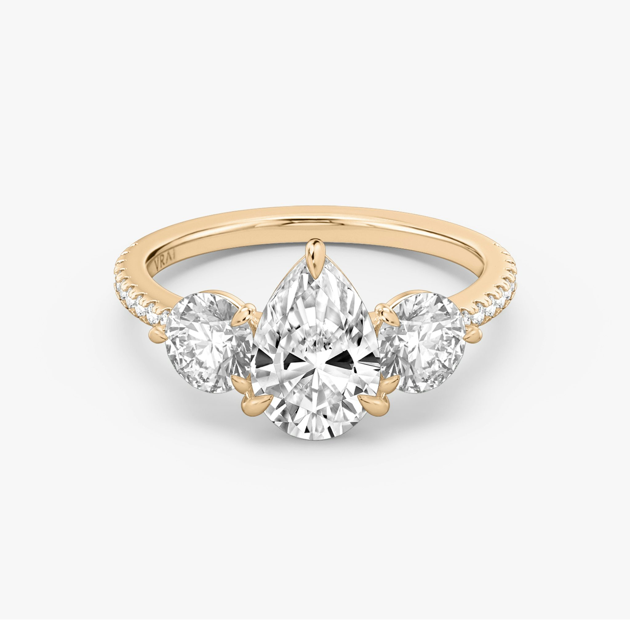 The Three Stone | Pear | 14k | Rose Gold | bandAccent: Pavé | sideStoneCarat: 0.50ct | sideStoneShape: Round Brilliant | diamondOrientation: vertical | caratWeight: other