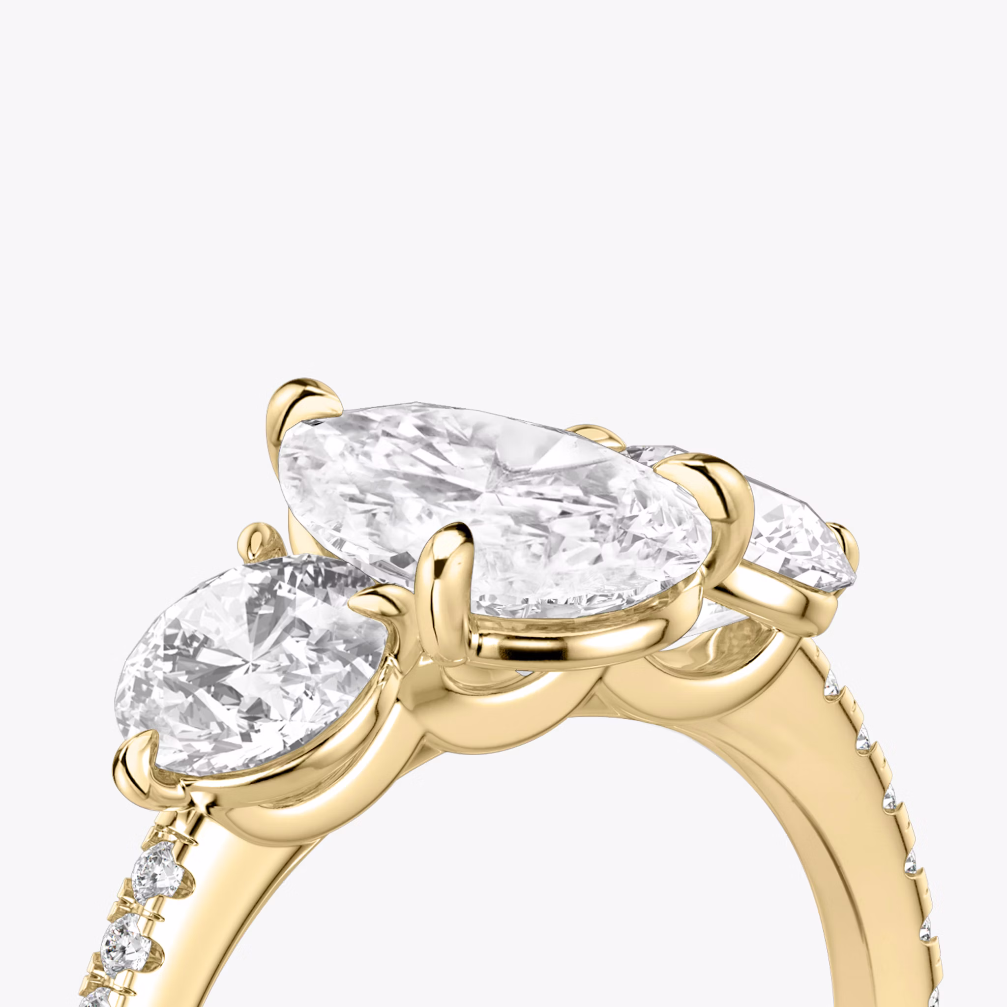 The Three Stone | Pear | 18k | Yellow Gold | bandAccent: Pavé | sideStoneCarat: 0.50ct | sideStoneShape: Round Brilliant | diamondOrientation: vertical | caratWeight: other