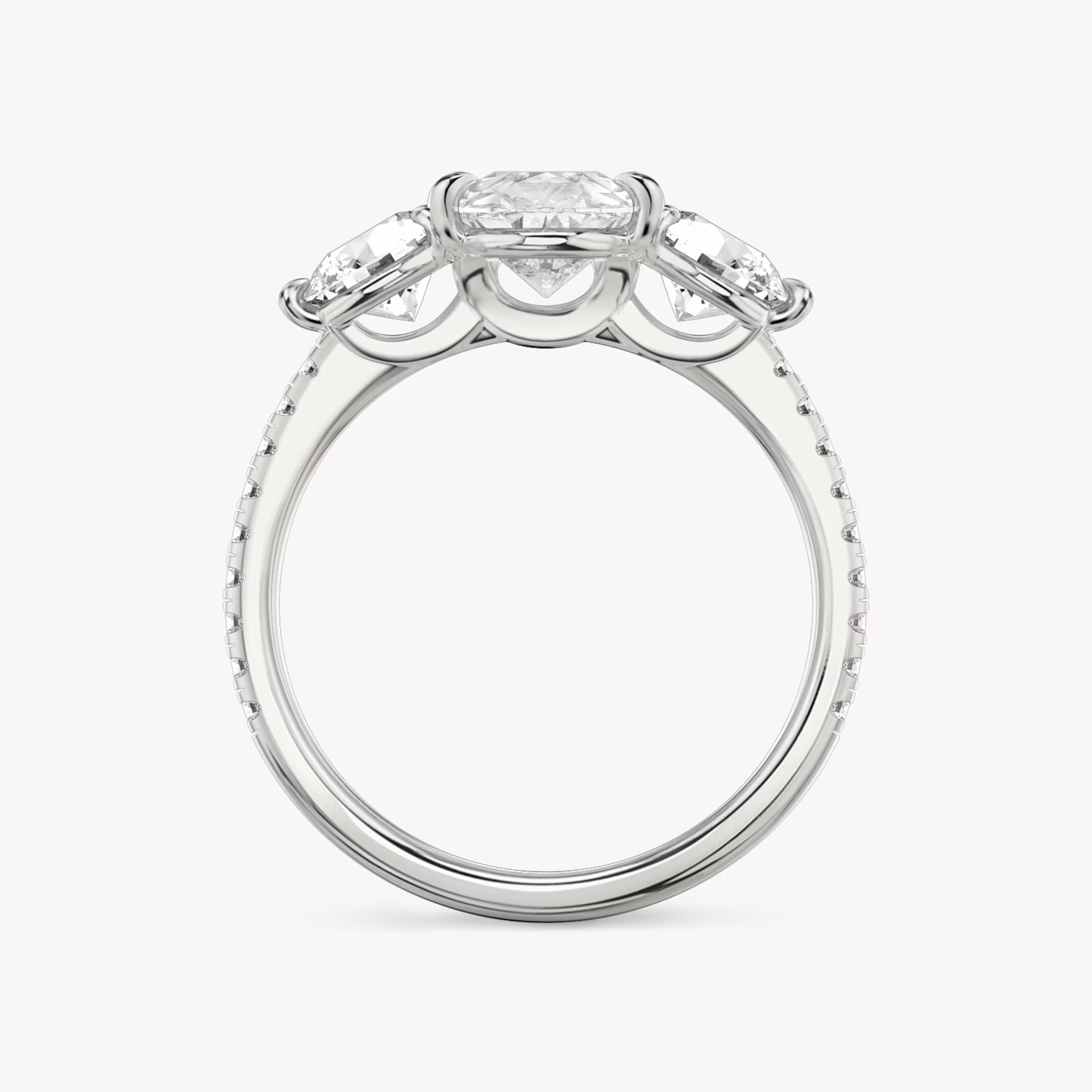 The Three Stone | Pear | Platinum | bandAccent: Pavé | sideStoneCarat: 0.50ct | sideStoneShape: Round Brilliant | diamondOrientation: vertical | caratWeight: other