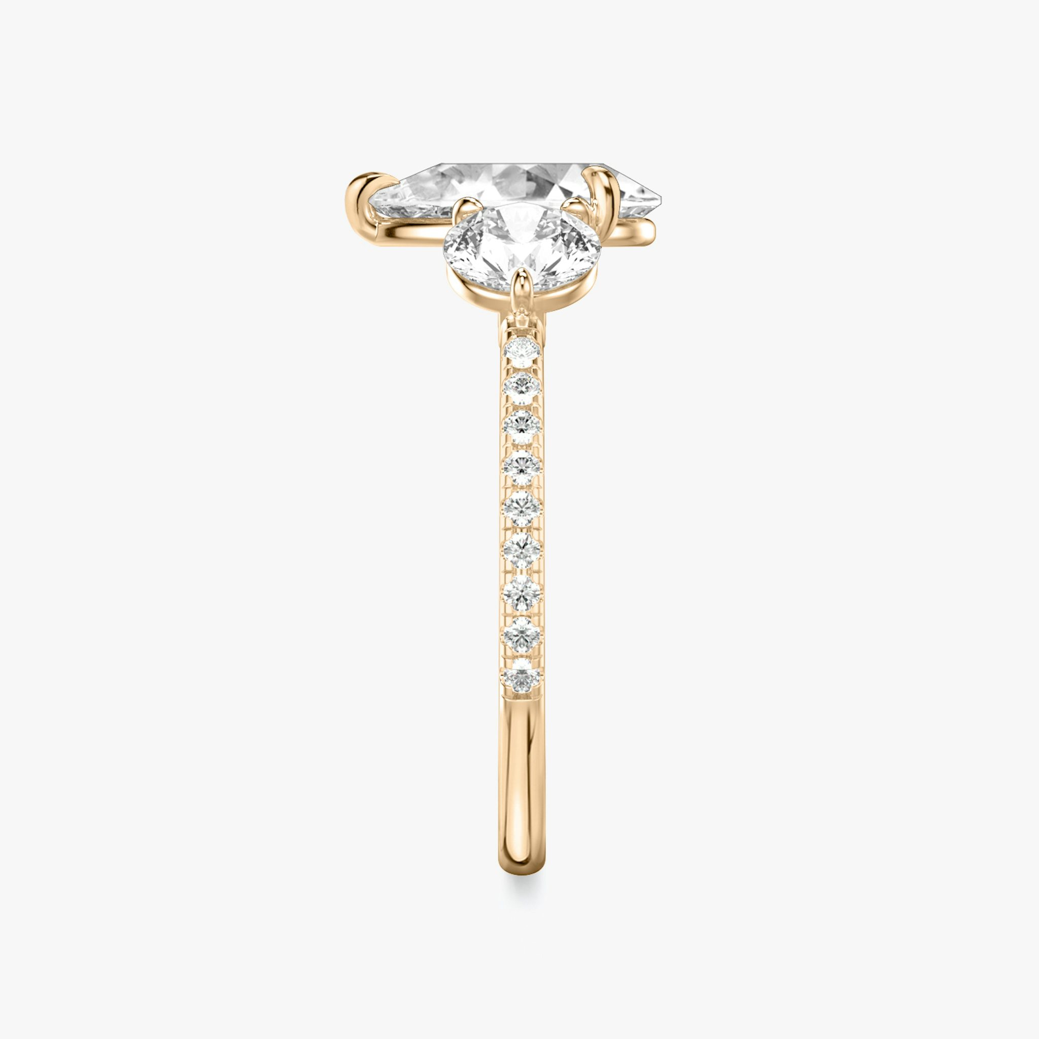 The Three Stone | Pear | 14k | Rose Gold | bandAccent: Pavé | sideStoneCarat: 0.50ct | sideStoneShape: Round Brilliant | diamondOrientation: vertical | caratWeight: other