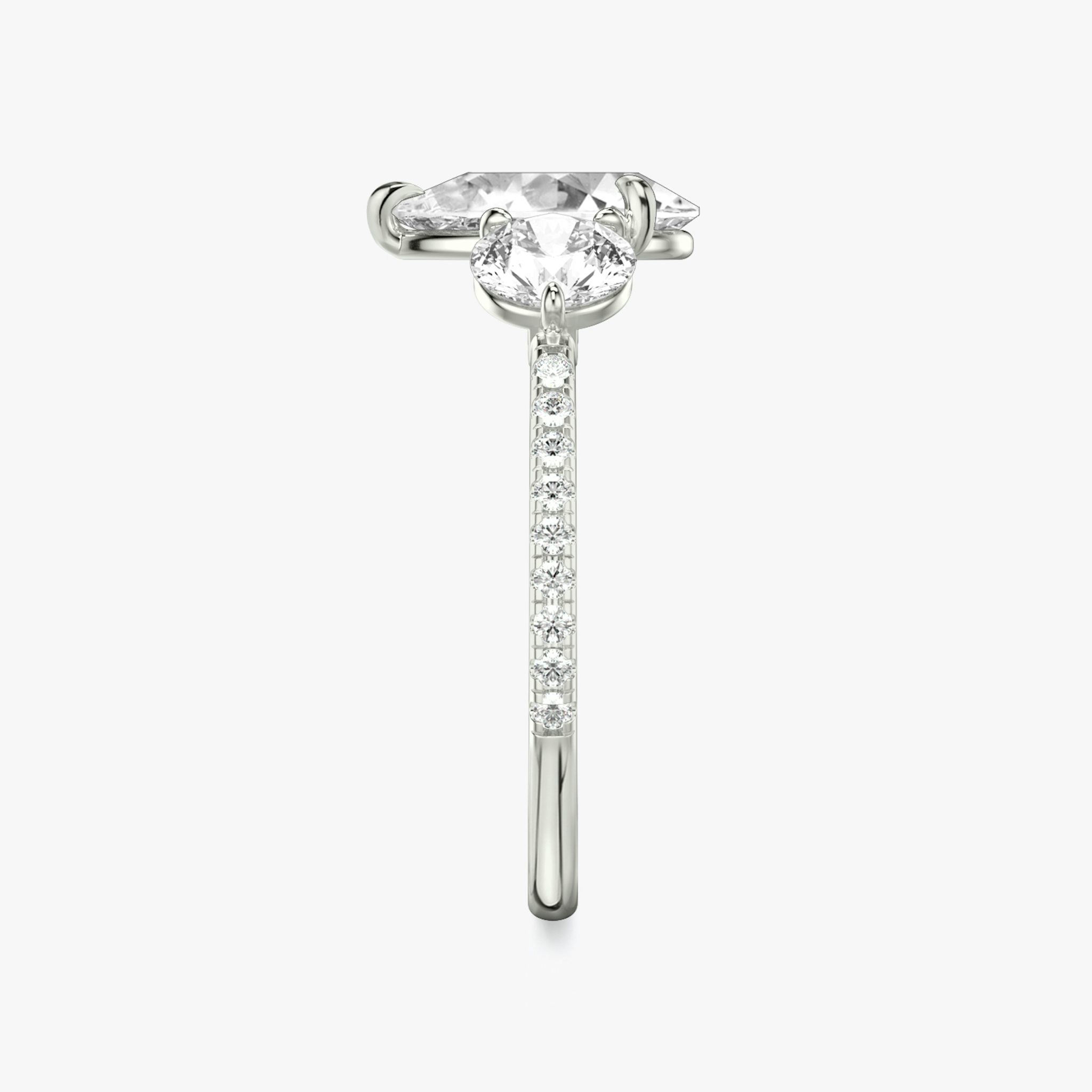 The Three Stone | Pear | Platinum | bandAccent: Pavé | sideStoneCarat: 0.50ct | sideStoneShape: Round Brilliant | diamondOrientation: vertical | caratWeight: other