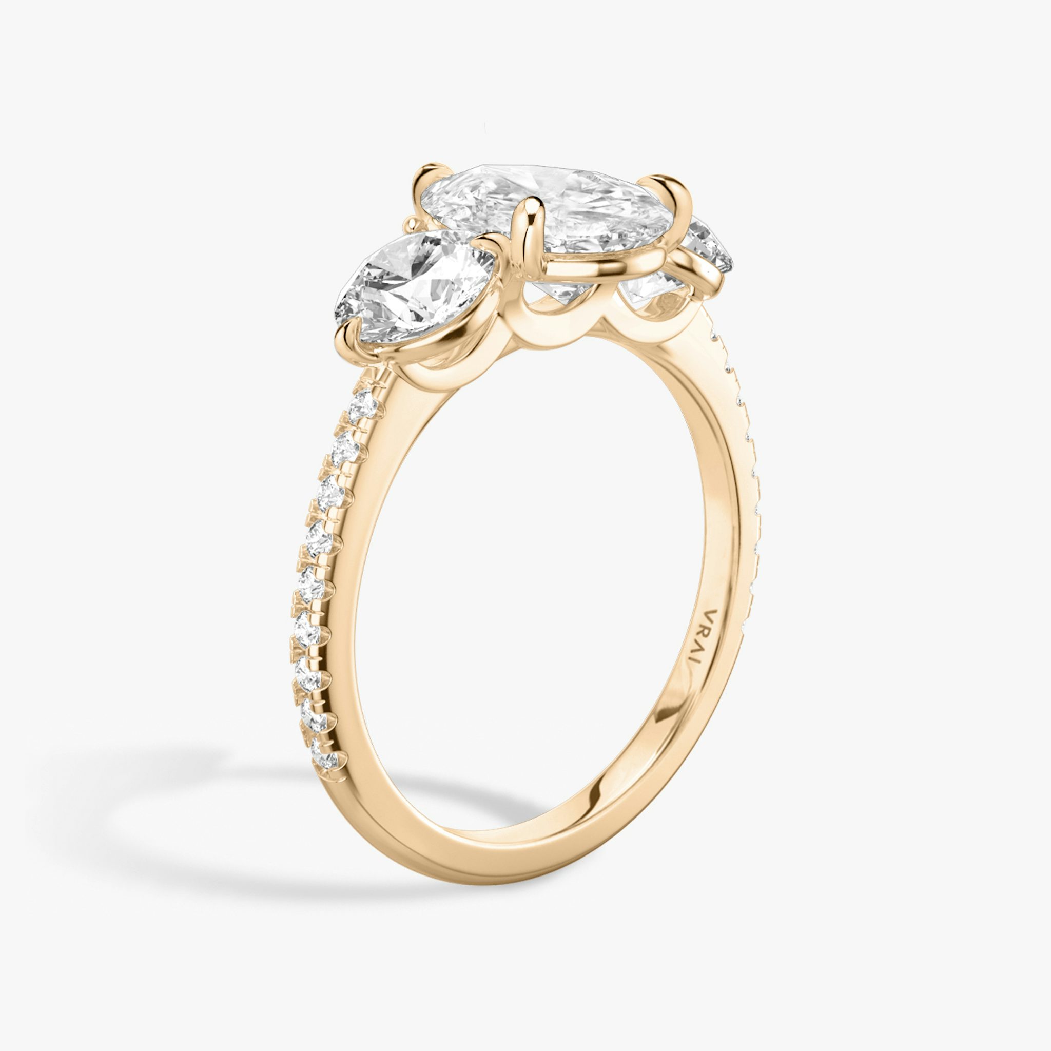 The Three Stone | Pear | 14k | Rose Gold | bandAccent: Pavé | sideStoneCarat: 0.50ct | sideStoneShape: Round Brilliant | diamondOrientation: vertical | caratWeight: other