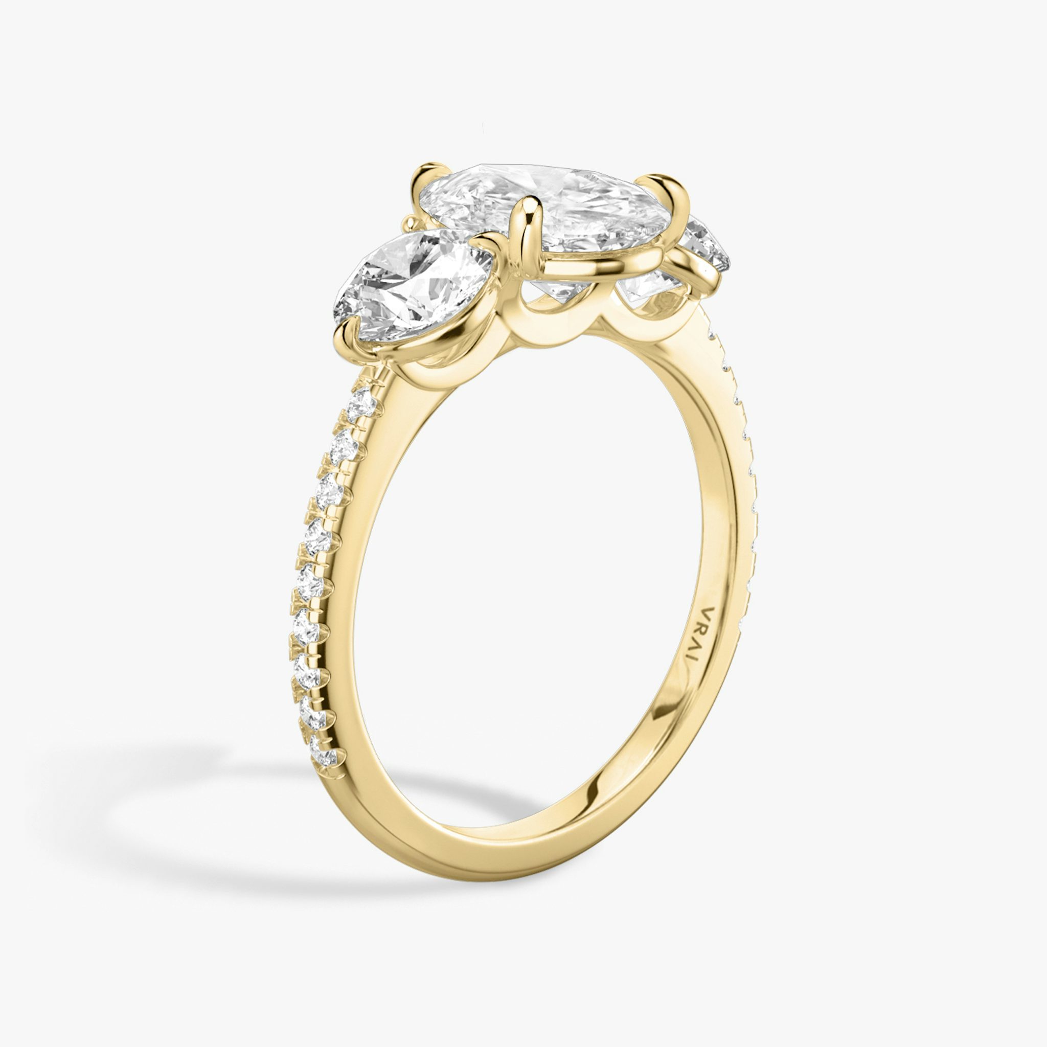 The Three Stone | Pear | 18k | Yellow Gold | bandAccent: Pavé | sideStoneCarat: 0.50ct | sideStoneShape: Round Brilliant | diamondOrientation: vertical | caratWeight: other