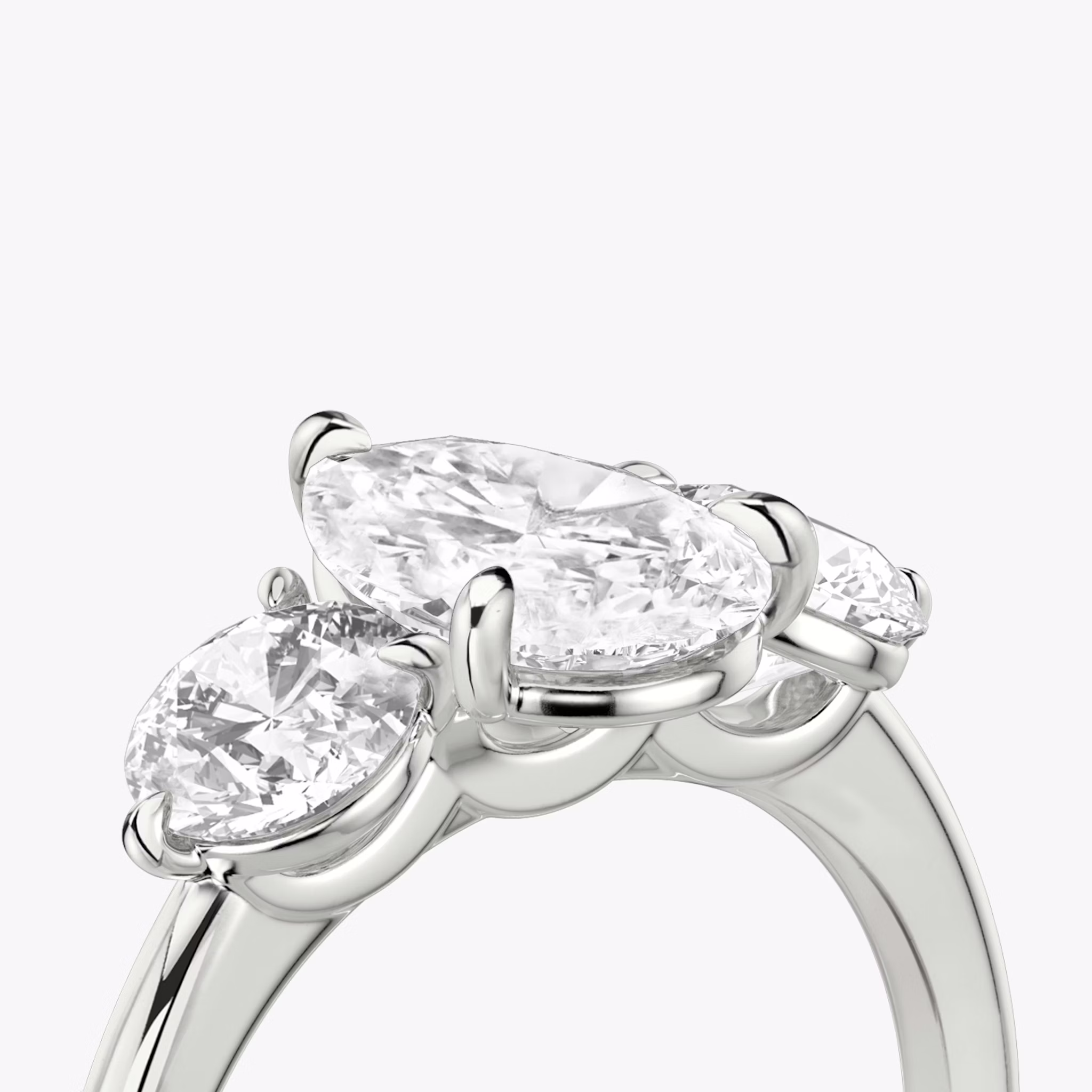 The Three Stone | Pear | 18k | White Gold | bandAccent: Plain | sideStoneCarat: 0.50ct | sideStoneShape: Round Brilliant | diamondOrientation: vertical | caratWeight: other