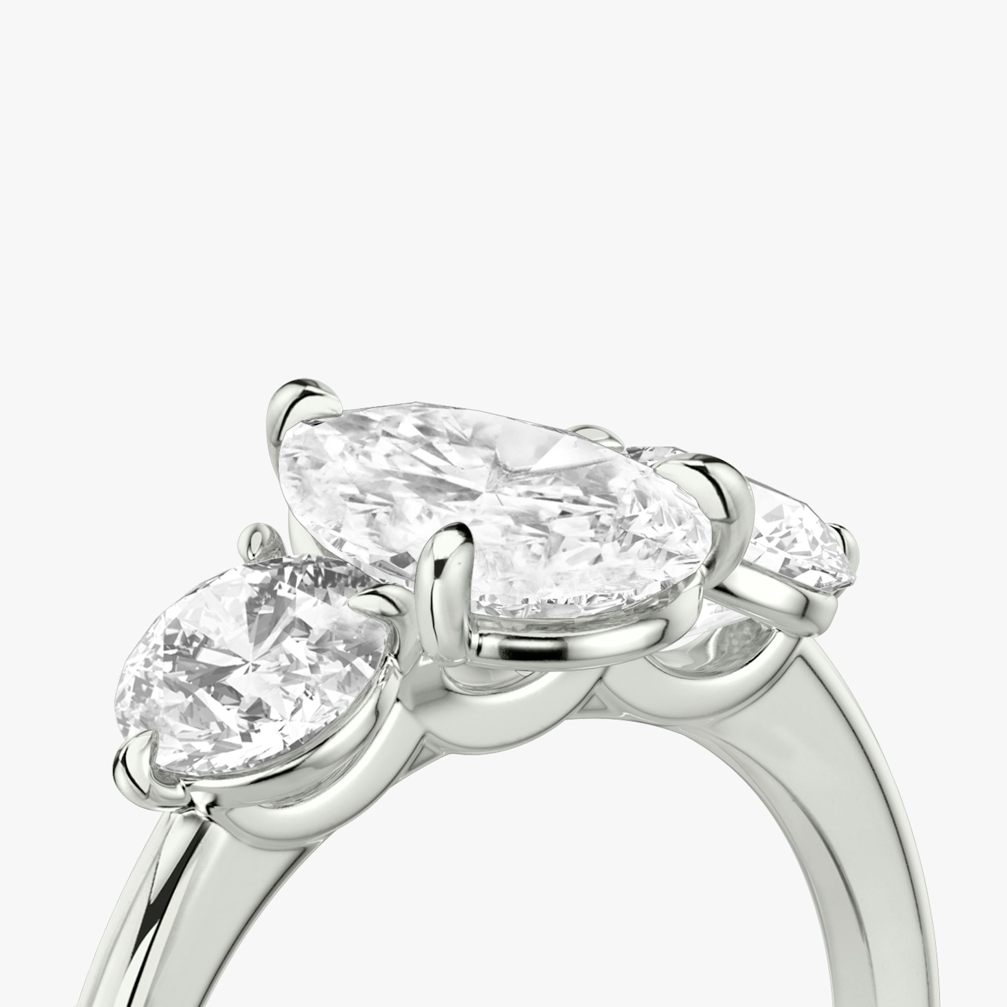 The Three Stone | Pear | 18k | White Gold | bandAccent: Plain | sideStoneCarat: 0.50ct | sideStoneShape: Round Brilliant | diamondOrientation: vertical | caratWeight: other