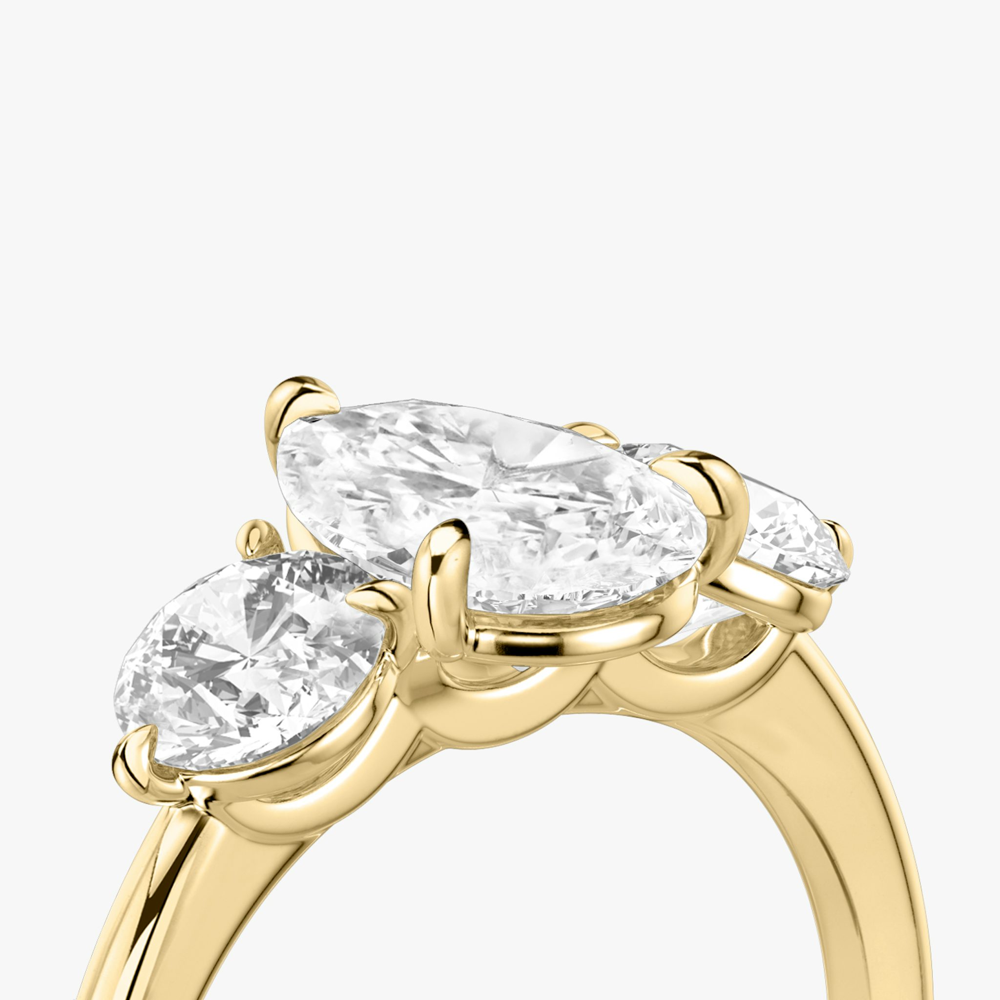 The Three Stone | Pear | 18k | Yellow Gold | bandAccent: Plain | sideStoneCarat: 0.50ct | sideStoneShape: Round Brilliant | diamondOrientation: vertical | caratWeight: other