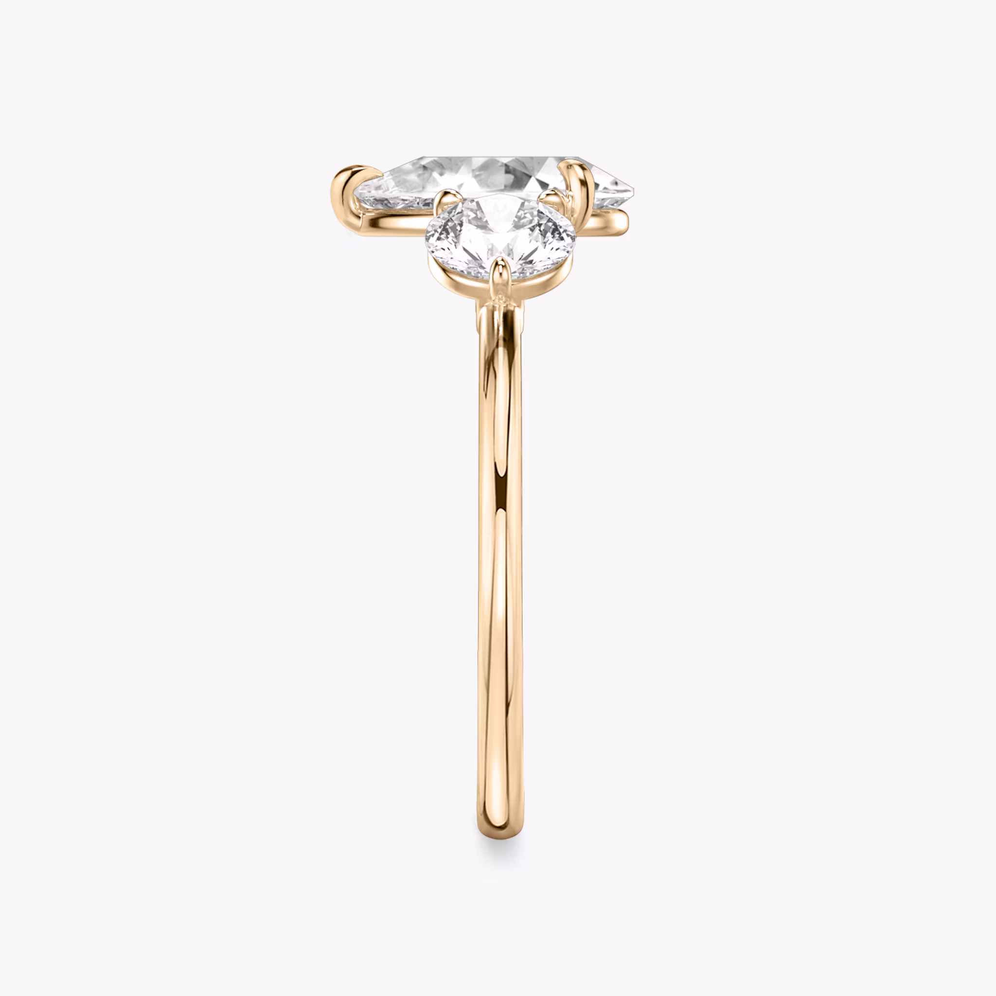 The Three Stone | Pear | 14k | Rose Gold | bandAccent: Plain | sideStoneCarat: 0.50ct | sideStoneShape: Round Brilliant | diamondOrientation: vertical | caratWeight: other