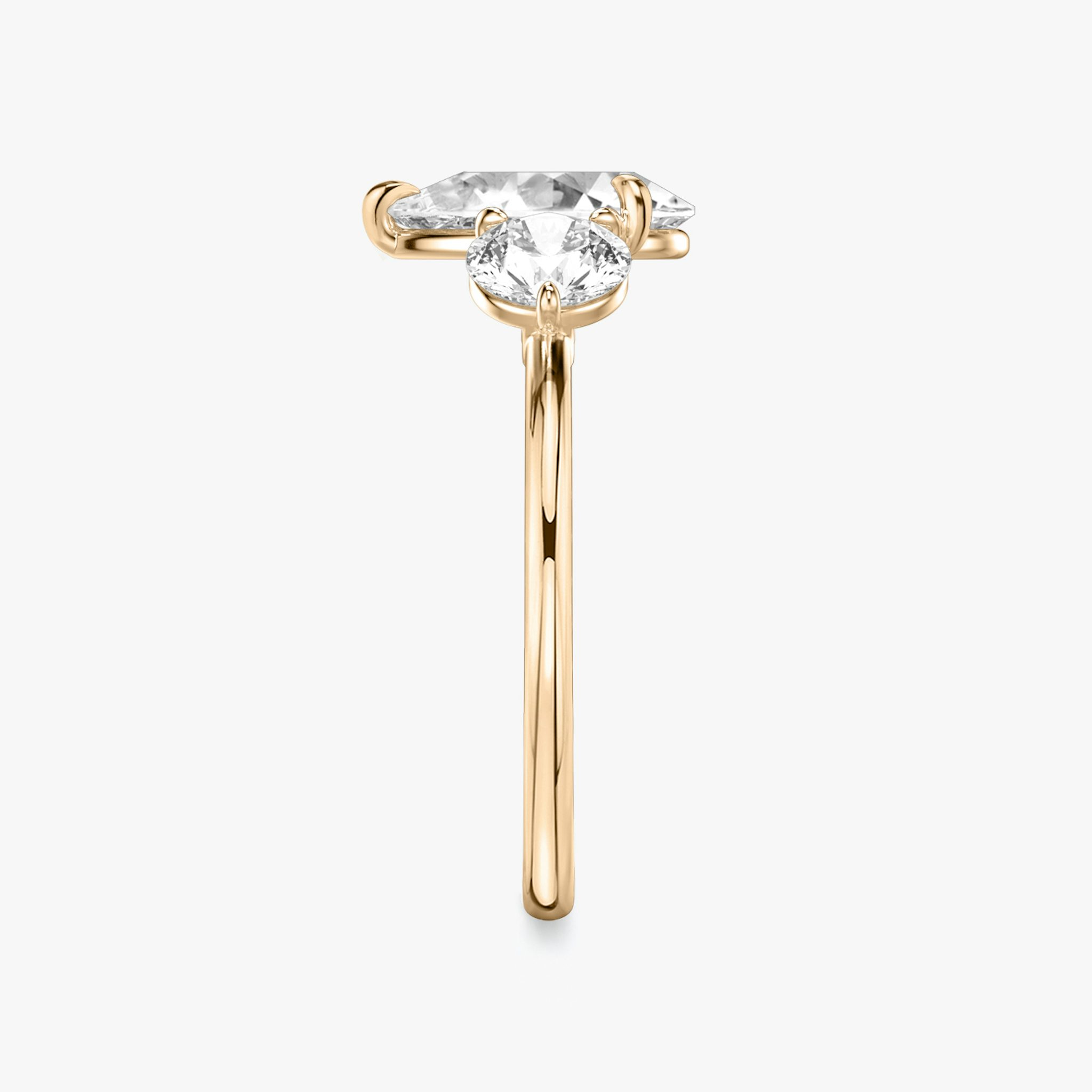 The Three Stone | Pear | 14k | Rose Gold | bandAccent: Plain | sideStoneCarat: 0.50ct | sideStoneShape: Round Brilliant | diamondOrientation: vertical | caratWeight: other