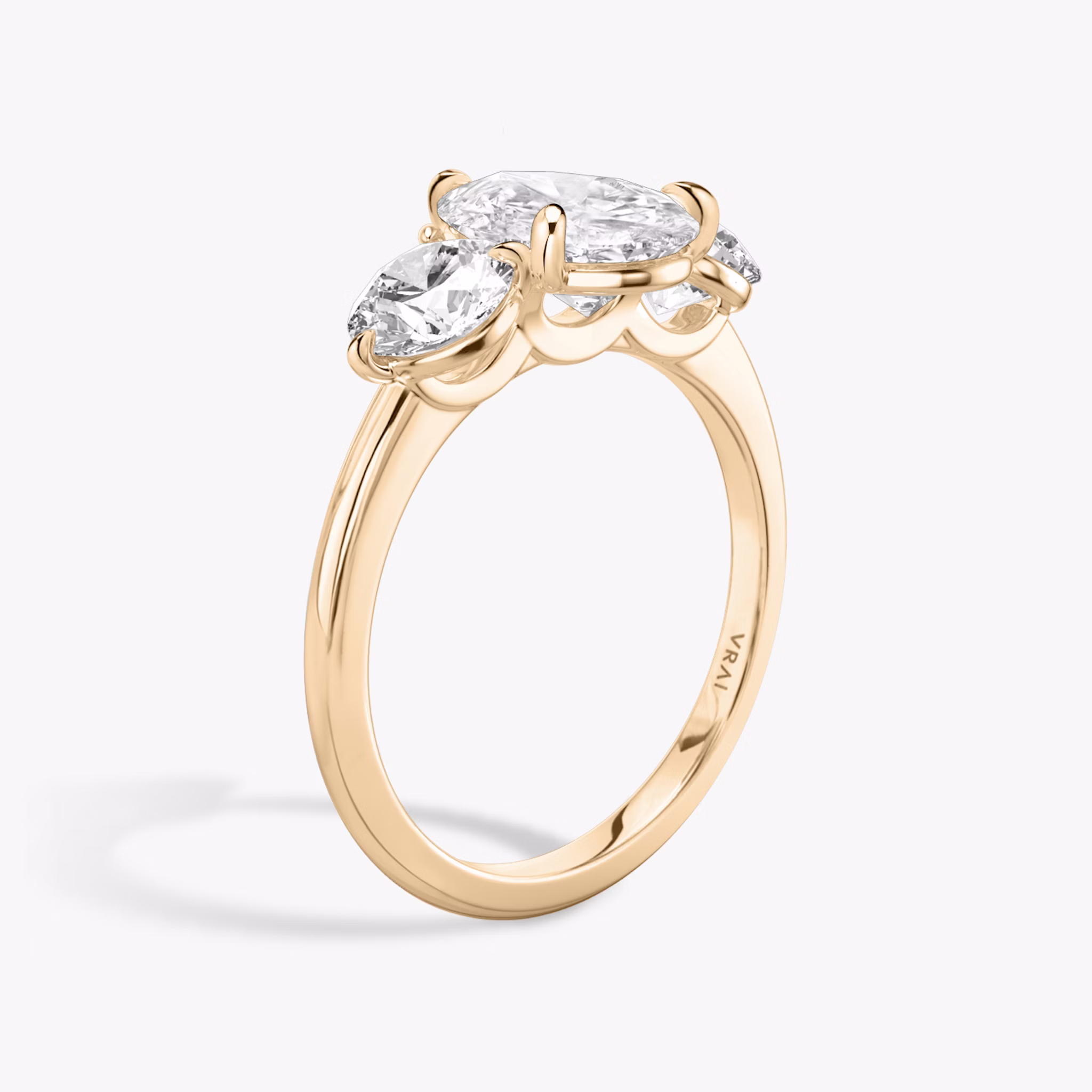 The Three Stone | Pear | 14k | Rose Gold | bandAccent: Plain | sideStoneCarat: 0.50ct | sideStoneShape: Round Brilliant | diamondOrientation: vertical | caratWeight: other