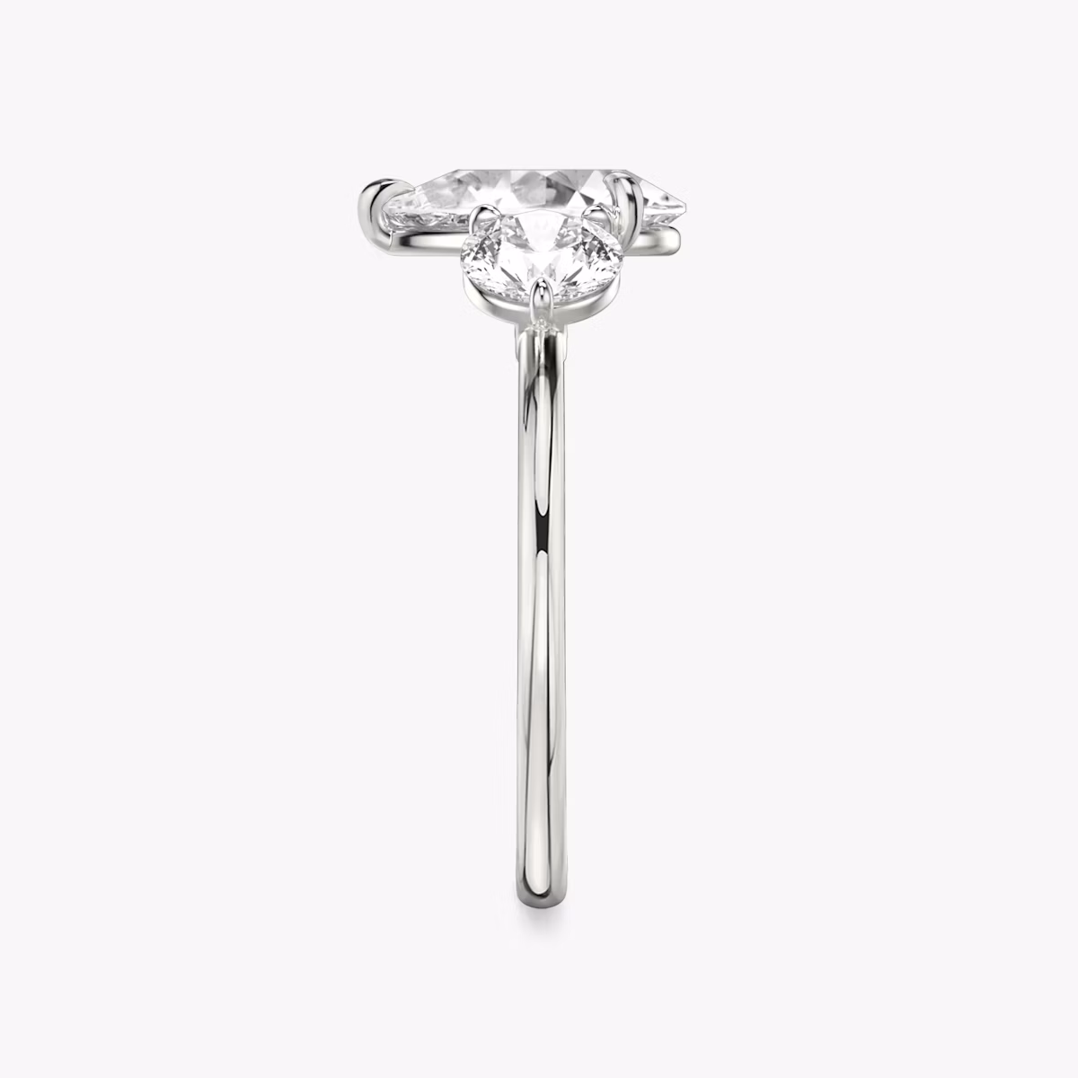 The Three Stone | Pear | Platinum | bandAccent: Plain | sideStoneCarat: 0.50ct | sideStoneShape: Round Brilliant | diamondOrientation: vertical | caratWeight: other