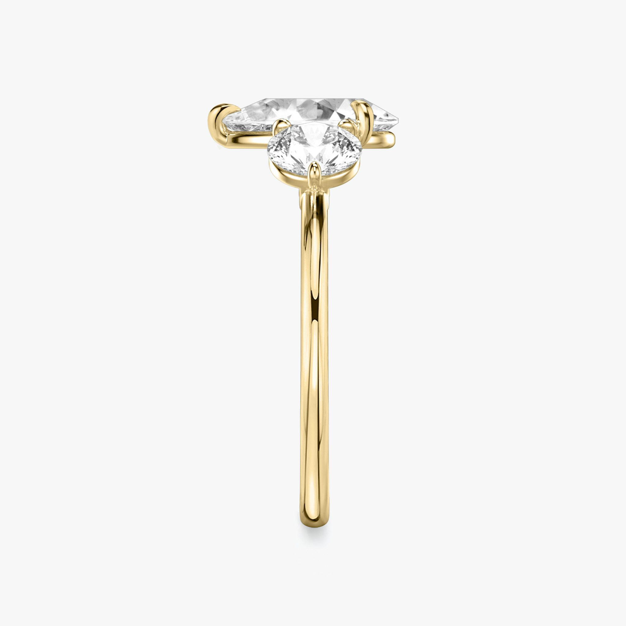 The Three Stone | Pear | 18k | Yellow Gold | bandAccent: Plain | sideStoneCarat: 0.50ct | sideStoneShape: Round Brilliant | diamondOrientation: vertical | caratWeight: other