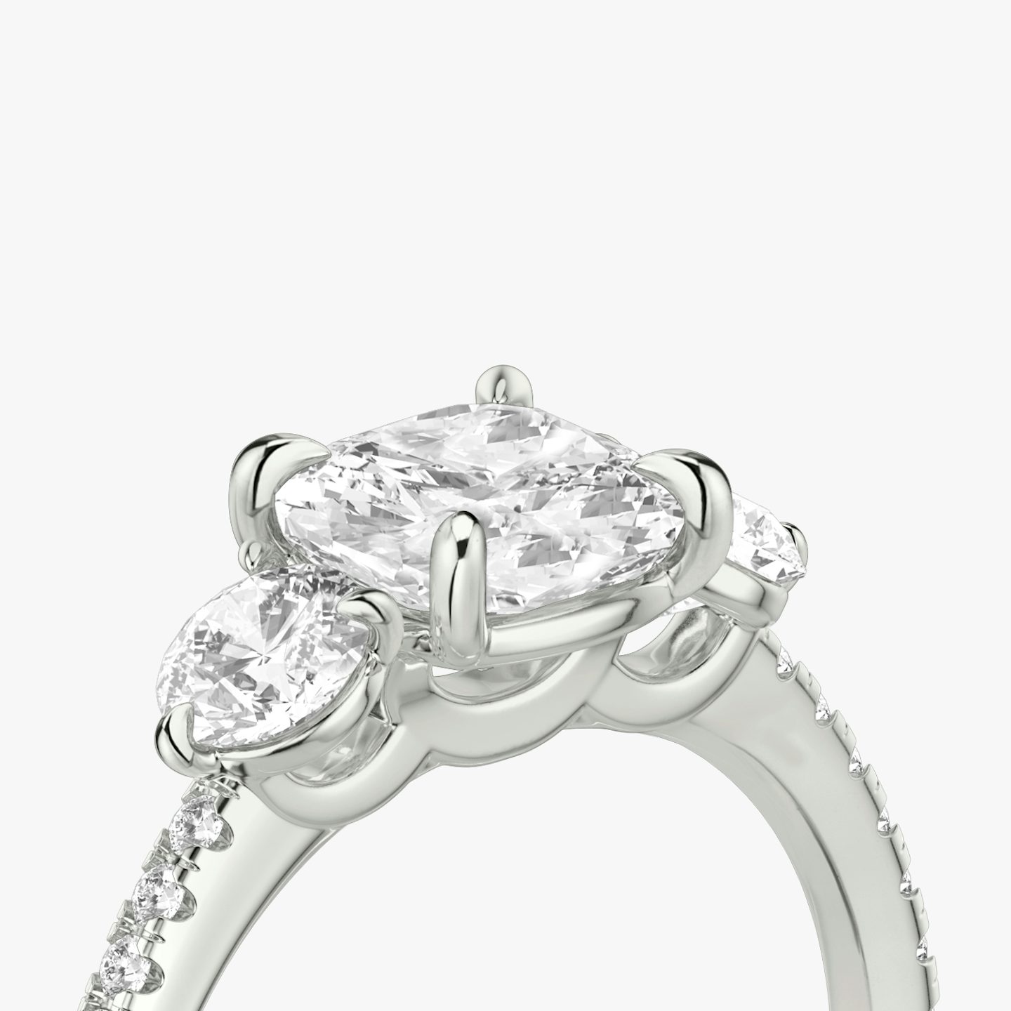 The Three Stone | Cushion | 18k | White Gold | bandAccent: Pavé | sideStoneCarat: 0.25ct | sideStoneShape: Round Brilliant | diamondOrientation: vertical | caratWeight: other