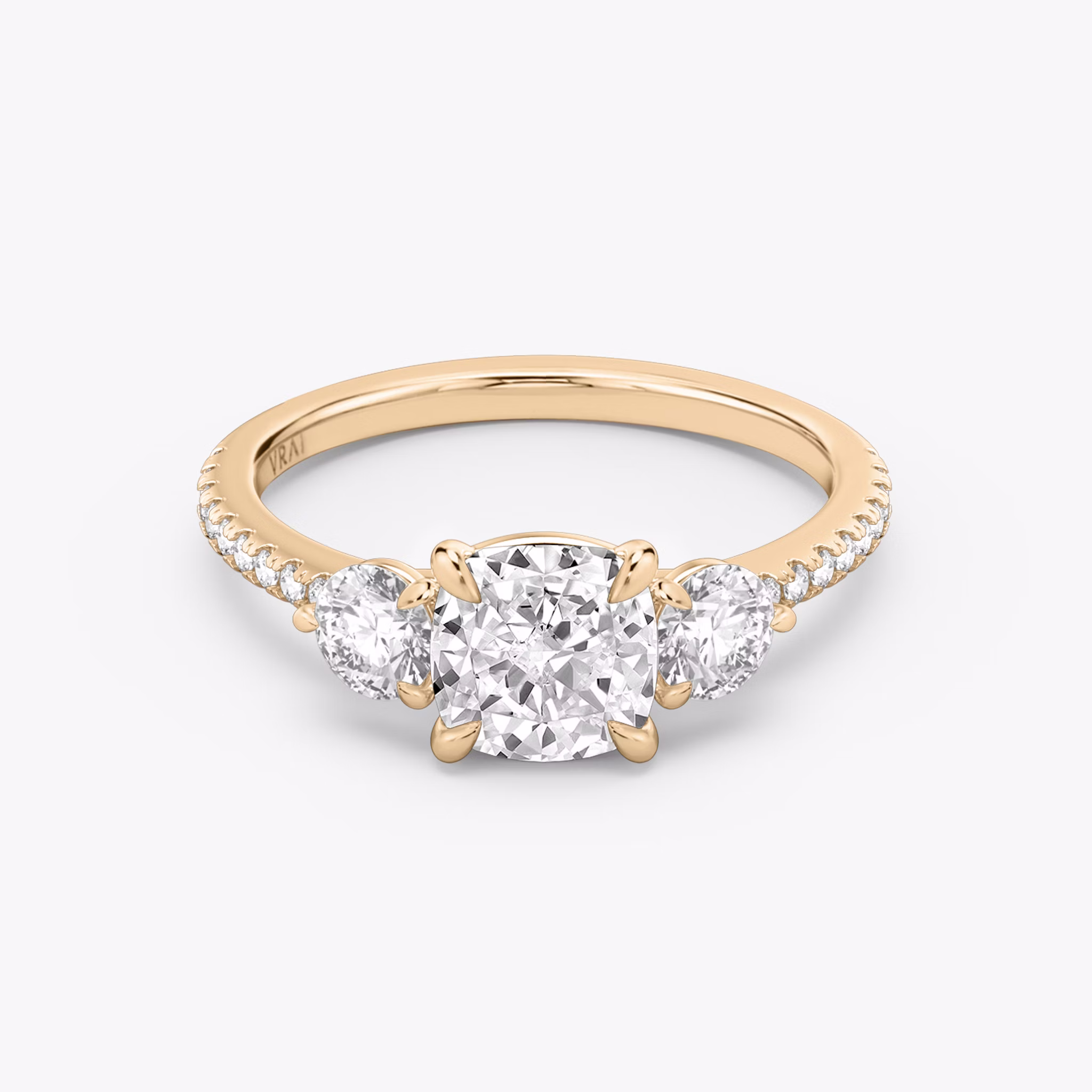 The Three Stone | Cushion | 14k | Rose Gold | bandAccent: Pavé | sideStoneCarat: 0.25ct | sideStoneShape: Round Brilliant | diamondOrientation: vertical | caratWeight: other