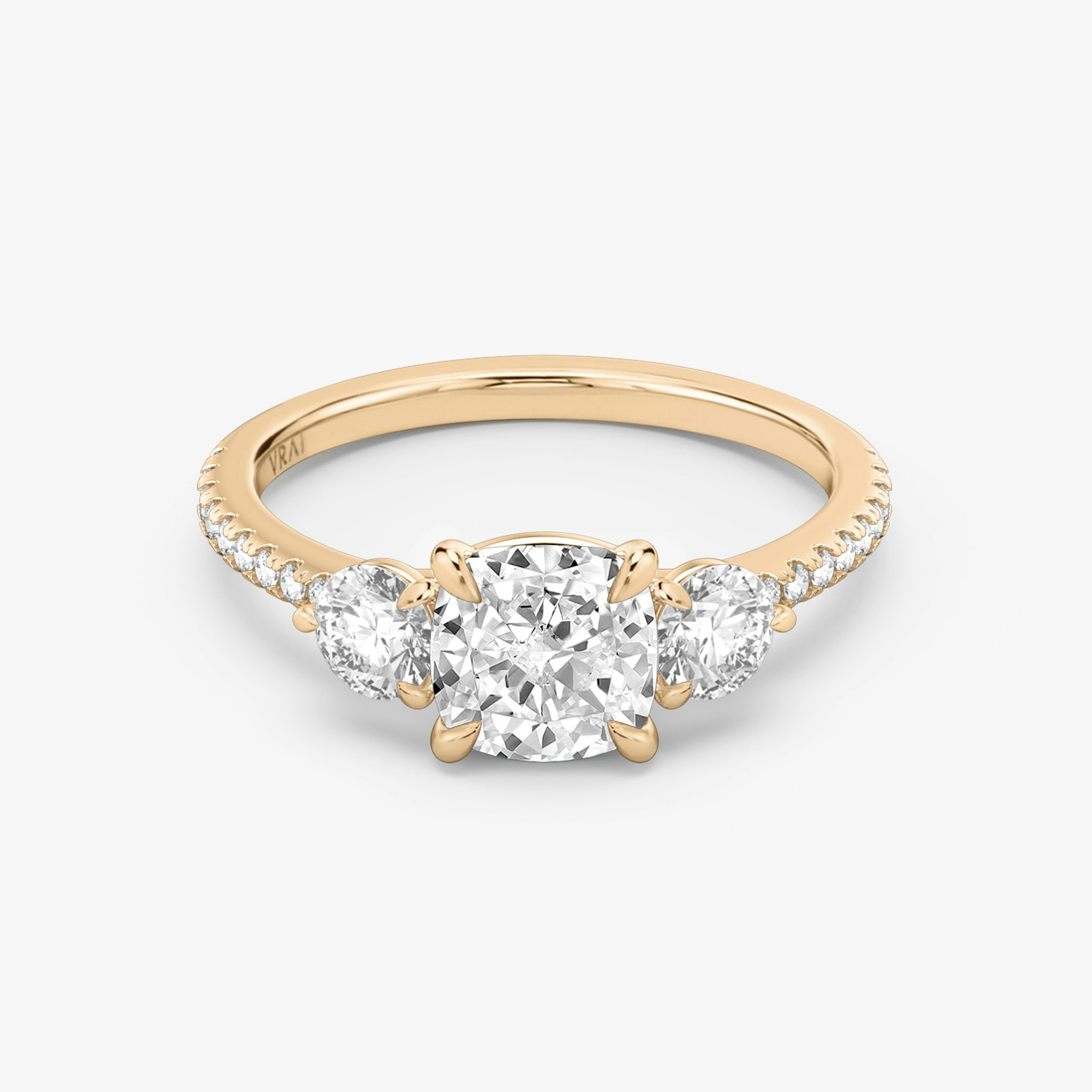 The Three Stone | Cushion | 14k | Rose Gold | bandAccent: Pavé | sideStoneCarat: 0.25ct | sideStoneShape: Round Brilliant | diamondOrientation: vertical | caratWeight: other