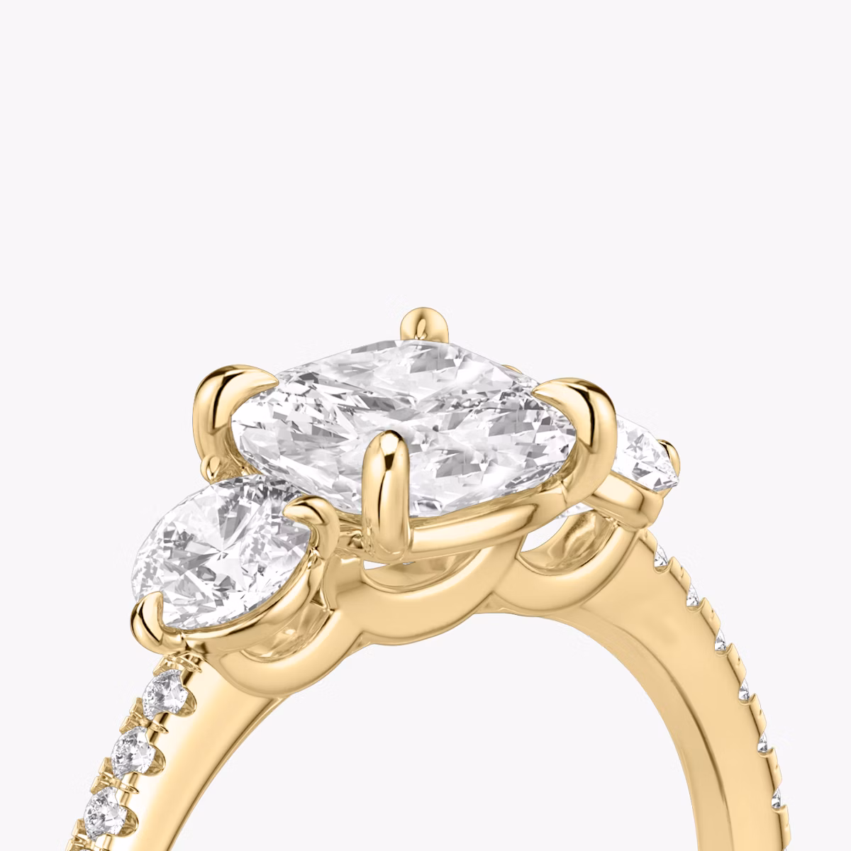 The Three Stone | Cushion | 18k | Yellow Gold | bandAccent: Pavé | sideStoneCarat: 0.25ct | sideStoneShape: Round Brilliant | diamondOrientation: vertical | caratWeight: other