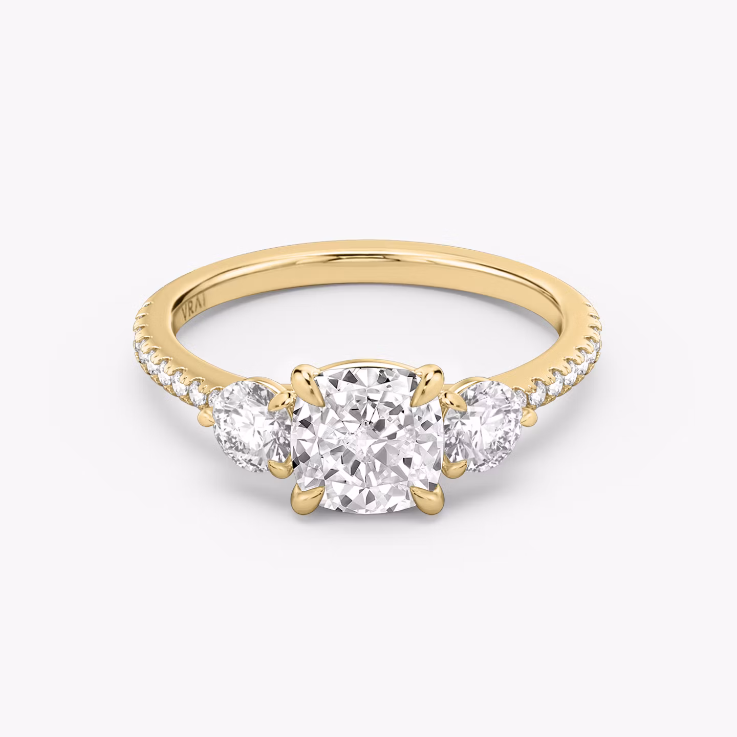 The Three Stone | Cushion | 18k | Yellow Gold | bandAccent: Pavé | sideStoneCarat: 0.25ct | sideStoneShape: Round Brilliant | diamondOrientation: vertical | caratWeight: other