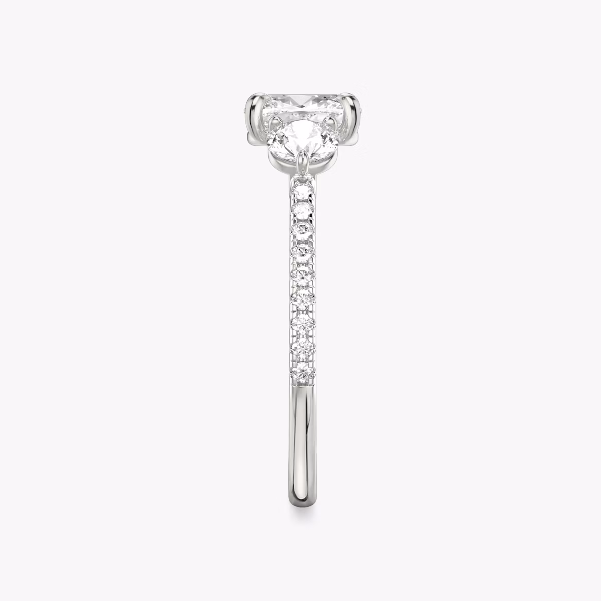 The Three Stone | Cushion | Platinum | bandAccent: Pavé | sideStoneCarat: 0.25ct | sideStoneShape: Round Brilliant | diamondOrientation: vertical | caratWeight: other