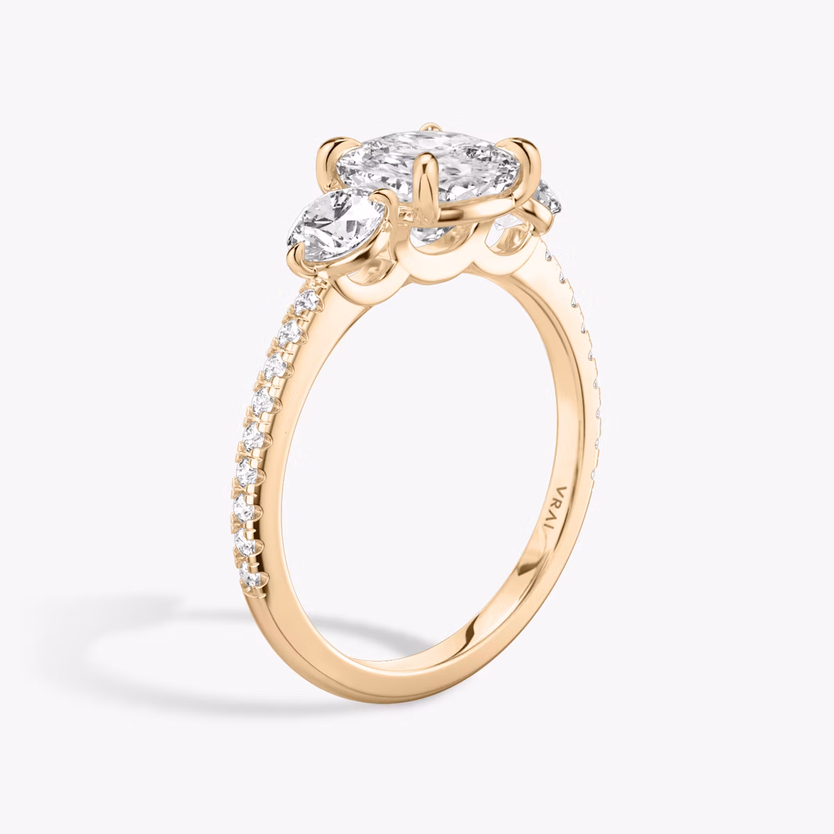 The Three Stone | Cushion | 14k | Rose Gold | bandAccent: Pavé | sideStoneCarat: 0.25ct | sideStoneShape: Round Brilliant | diamondOrientation: vertical | caratWeight: other