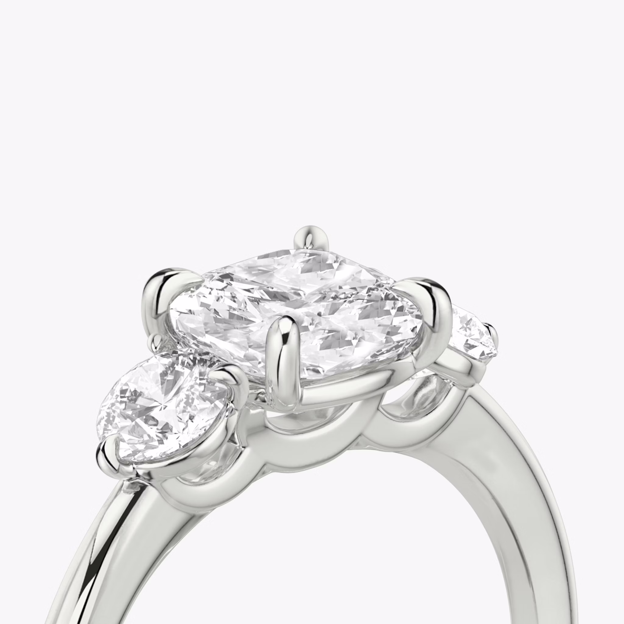 The Three Stone | Cushion | Platinum | bandAccent: Plain | sideStoneCarat: 0.25ct | sideStoneShape: Round Brilliant | diamondOrientation: vertical | caratWeight: other