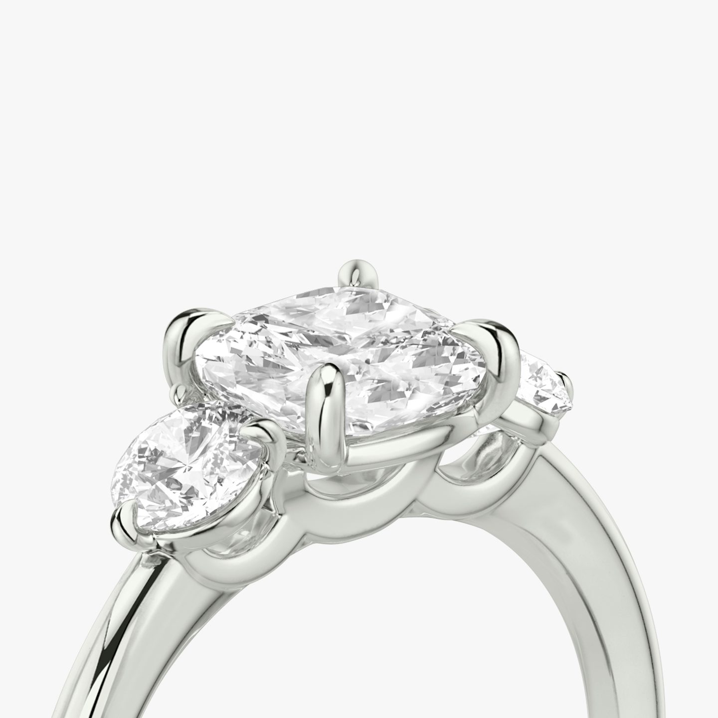 The Three Stone | Cushion | Platinum | bandAccent: Plain | sideStoneCarat: 0.25ct | sideStoneShape: Round Brilliant | diamondOrientation: vertical | caratWeight: other
