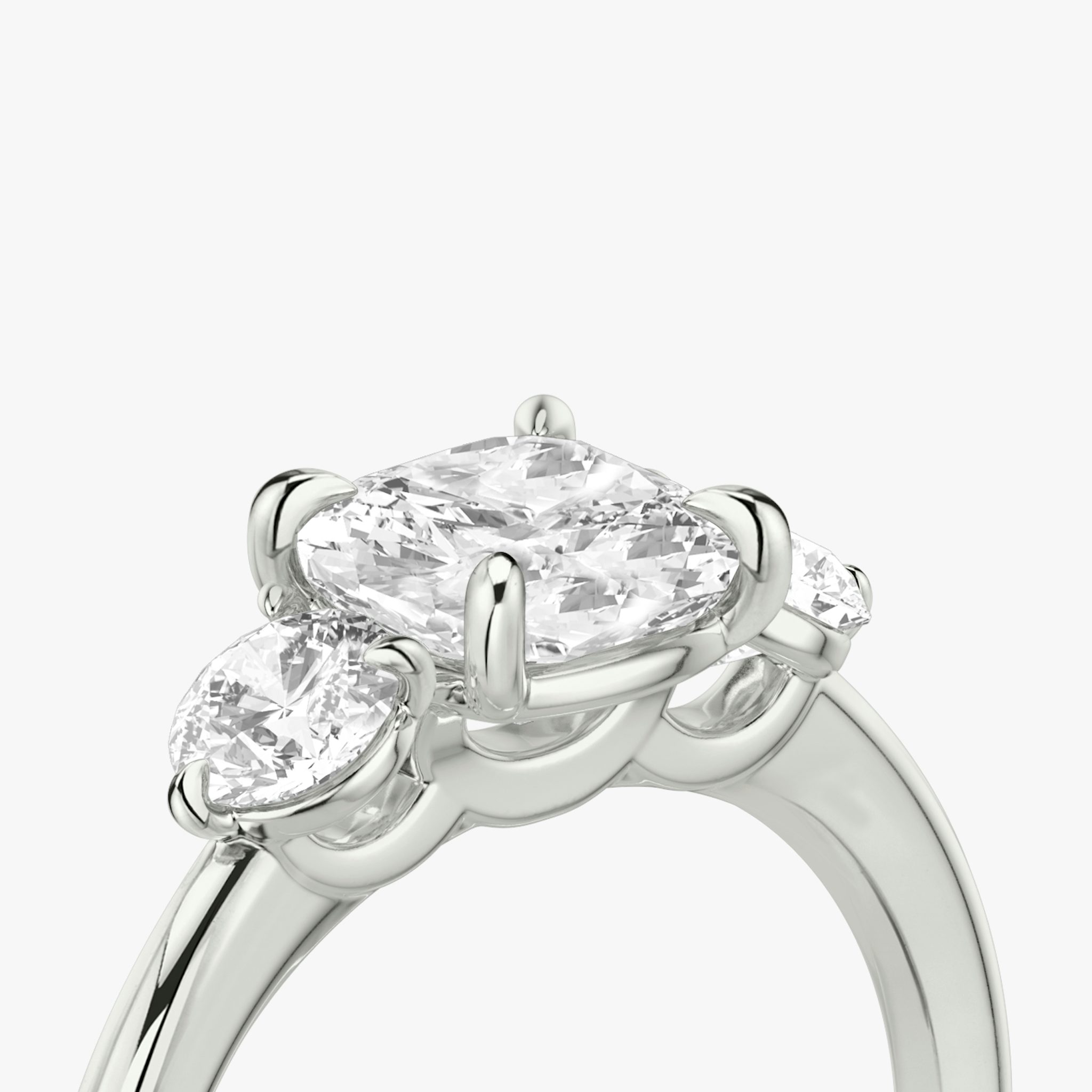 The Three Stone | Cushion | Platinum | bandAccent: Plain | sideStoneCarat: 0.25ct | sideStoneShape: Round Brilliant | diamondOrientation: vertical | caratWeight: other
