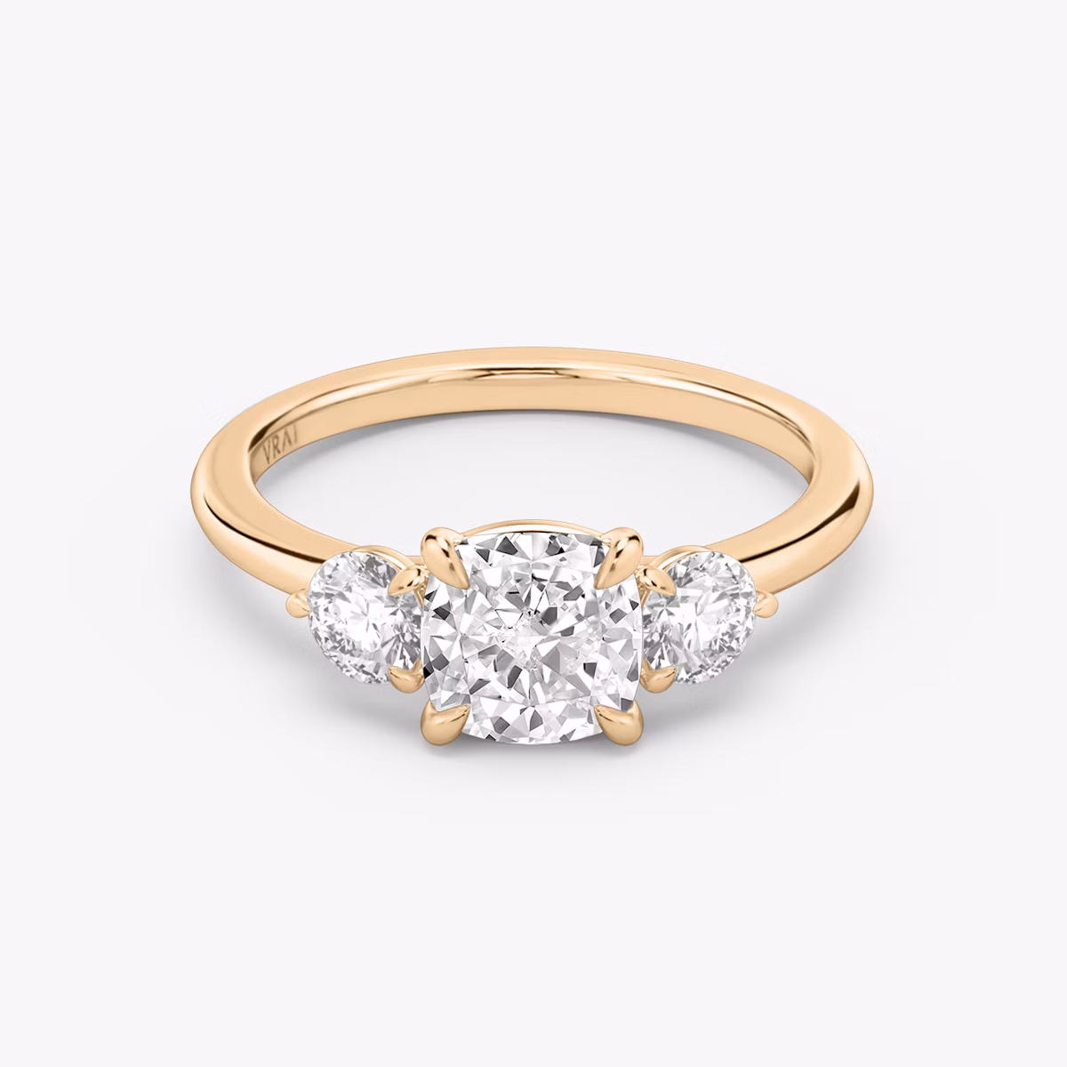 The Three Stone | Cushion | 14k | Rose Gold | bandAccent: Plain | sideStoneCarat: 0.25ct | sideStoneShape: Round Brilliant | diamondOrientation: vertical | caratWeight: other