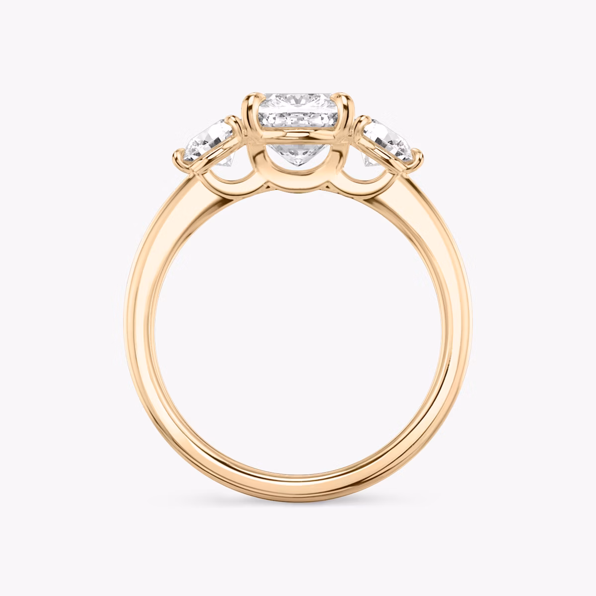The Three Stone | Cushion | 14k | Rose Gold | bandAccent: Plain | sideStoneCarat: 0.25ct | sideStoneShape: Round Brilliant | diamondOrientation: vertical | caratWeight: other