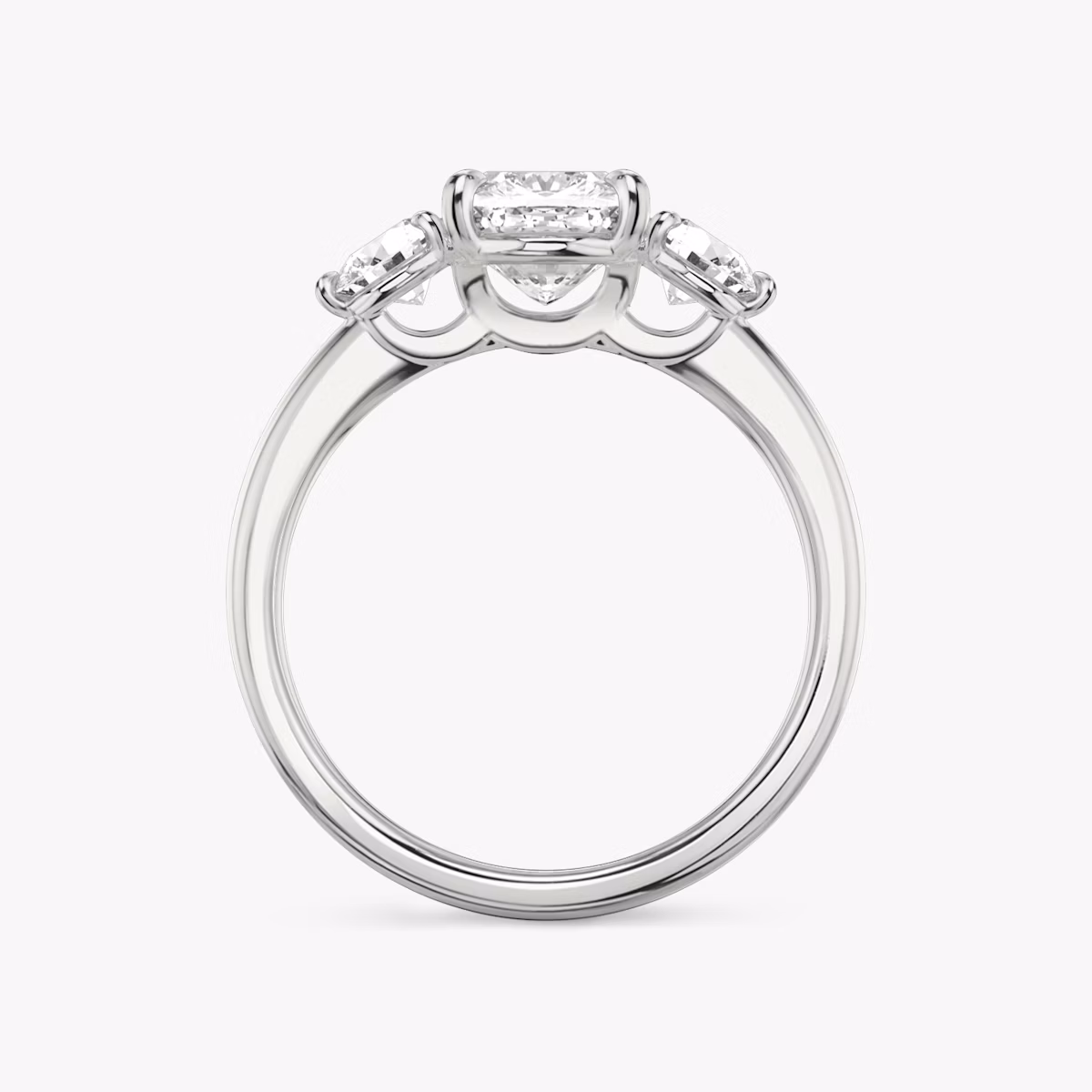 The Three Stone | Cushion | 18k | White Gold | bandAccent: Plain | sideStoneCarat: 0.25ct | sideStoneShape: Round Brilliant | diamondOrientation: vertical | caratWeight: other