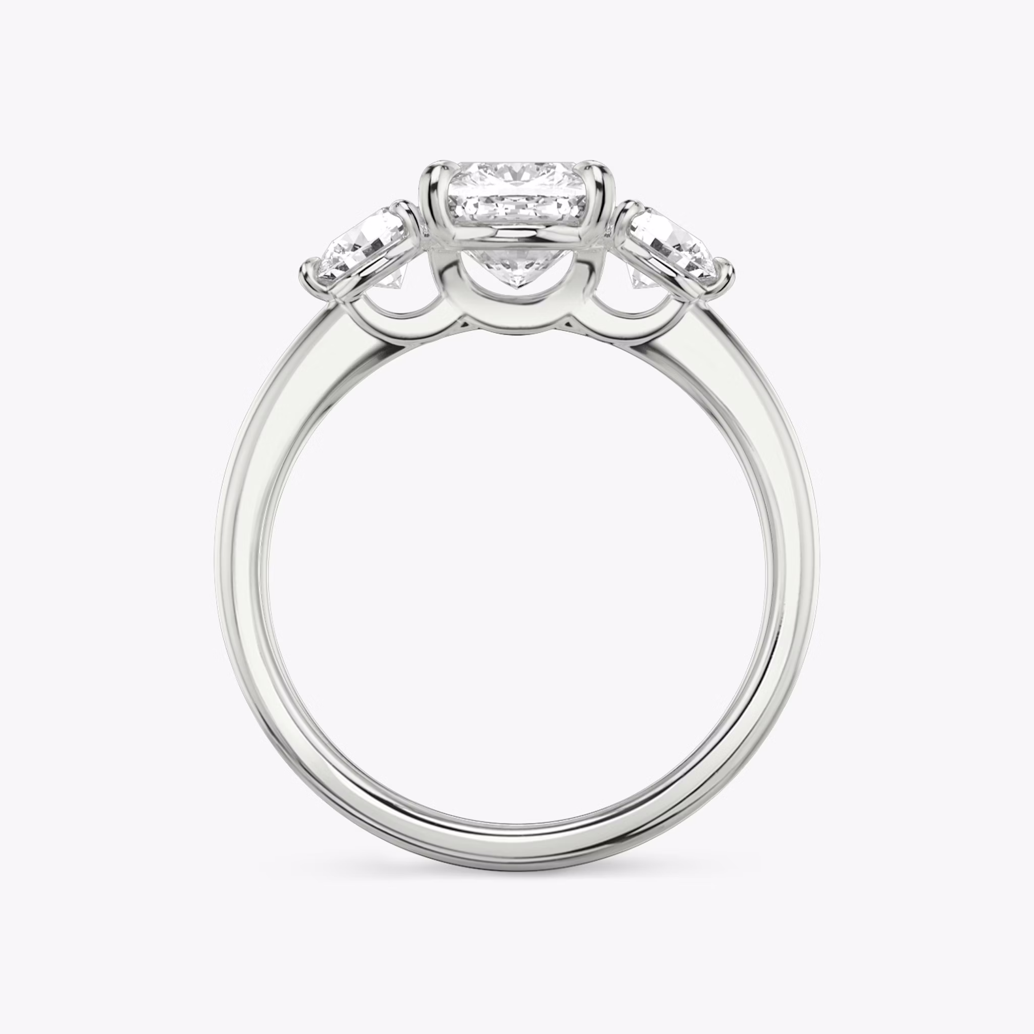 The Three Stone | Cushion | Platinum | bandAccent: Plain | sideStoneCarat: 0.25ct | sideStoneShape: Round Brilliant | diamondOrientation: vertical | caratWeight: other